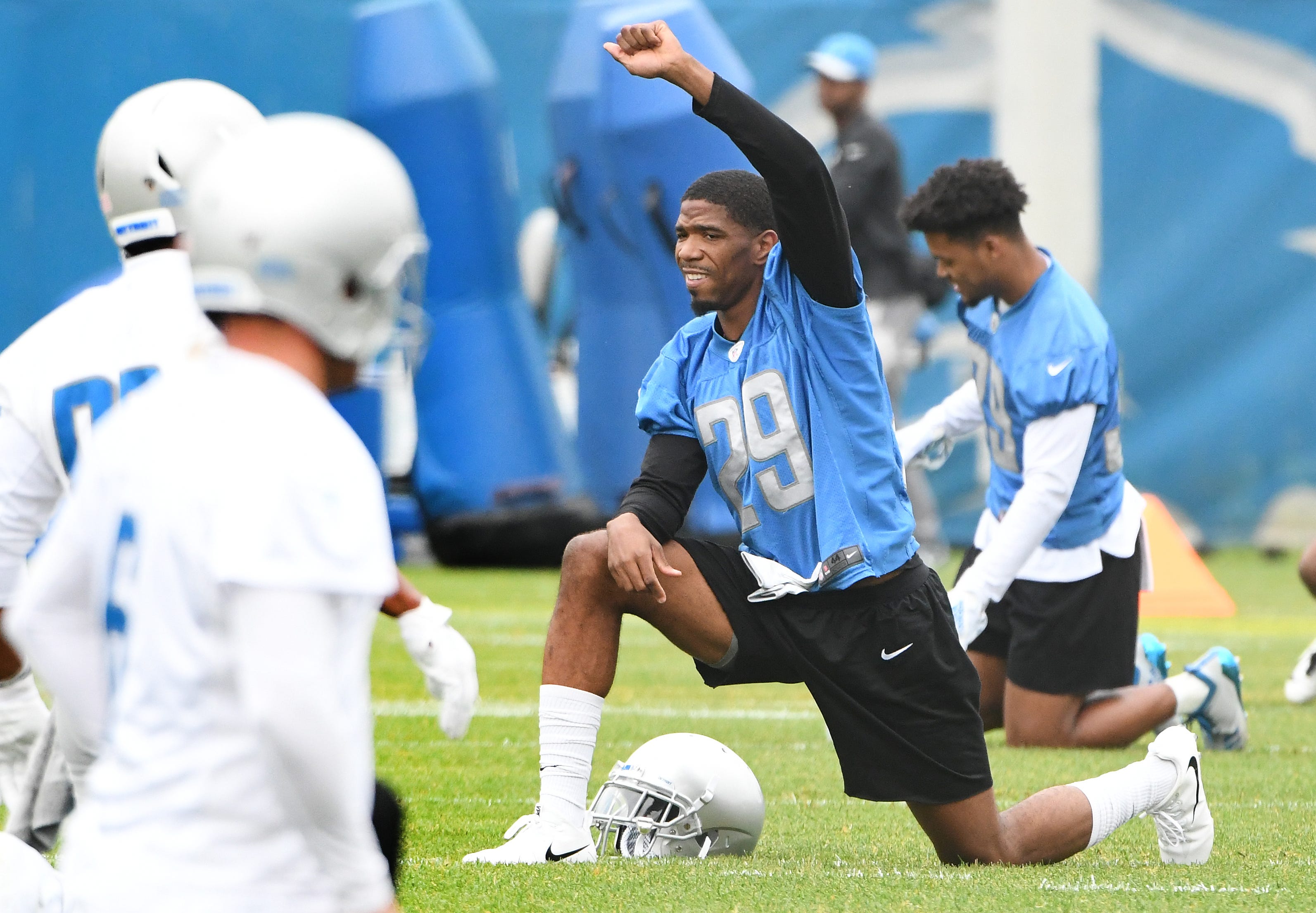 Lions cornerback Tashaan Melvin stretches during the start of practice.