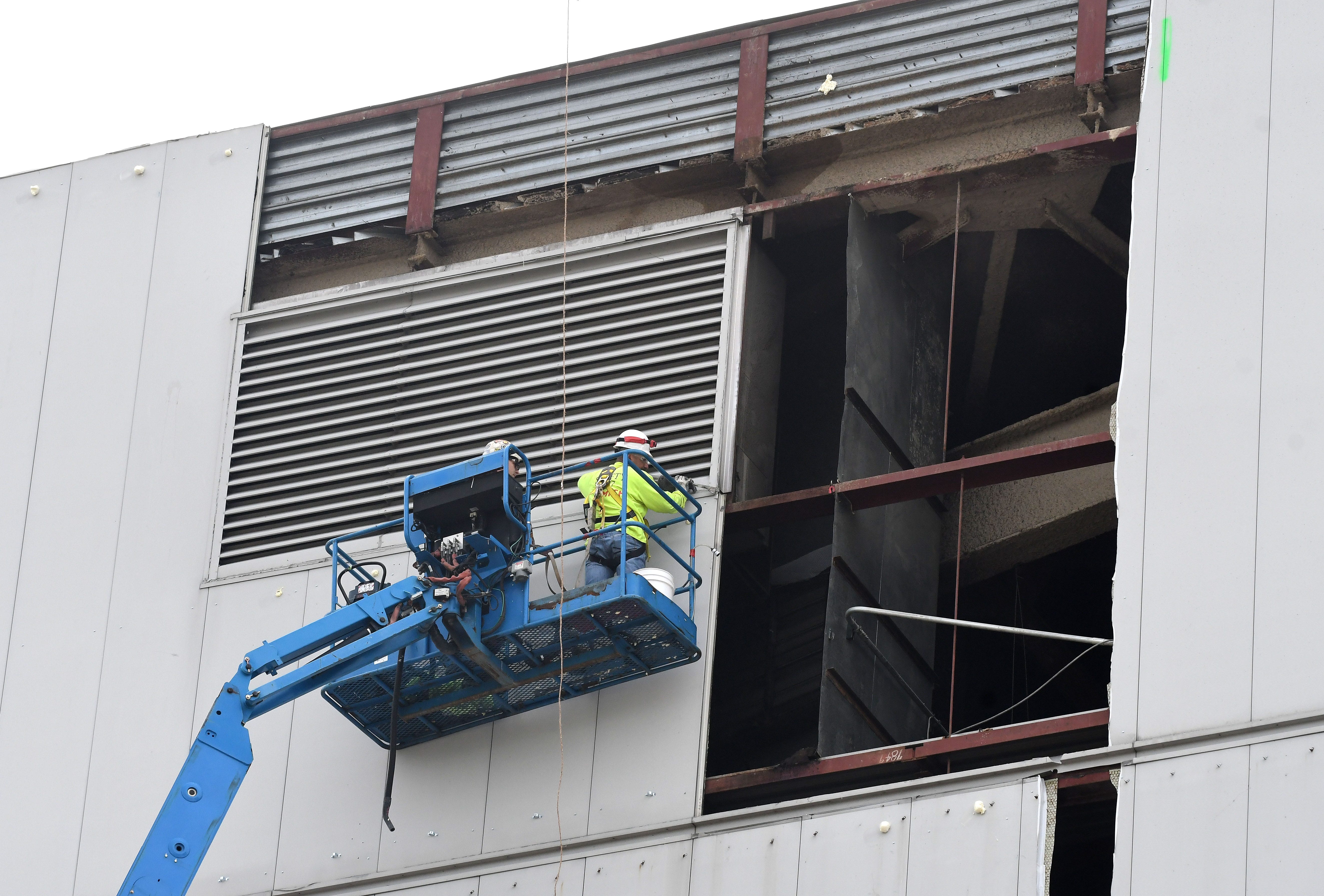 A contractor has started removing Joe Louis Arena's exterior metal panels as part of the stadium's demolition, which is expected to continue until late 2019 or early 2020.