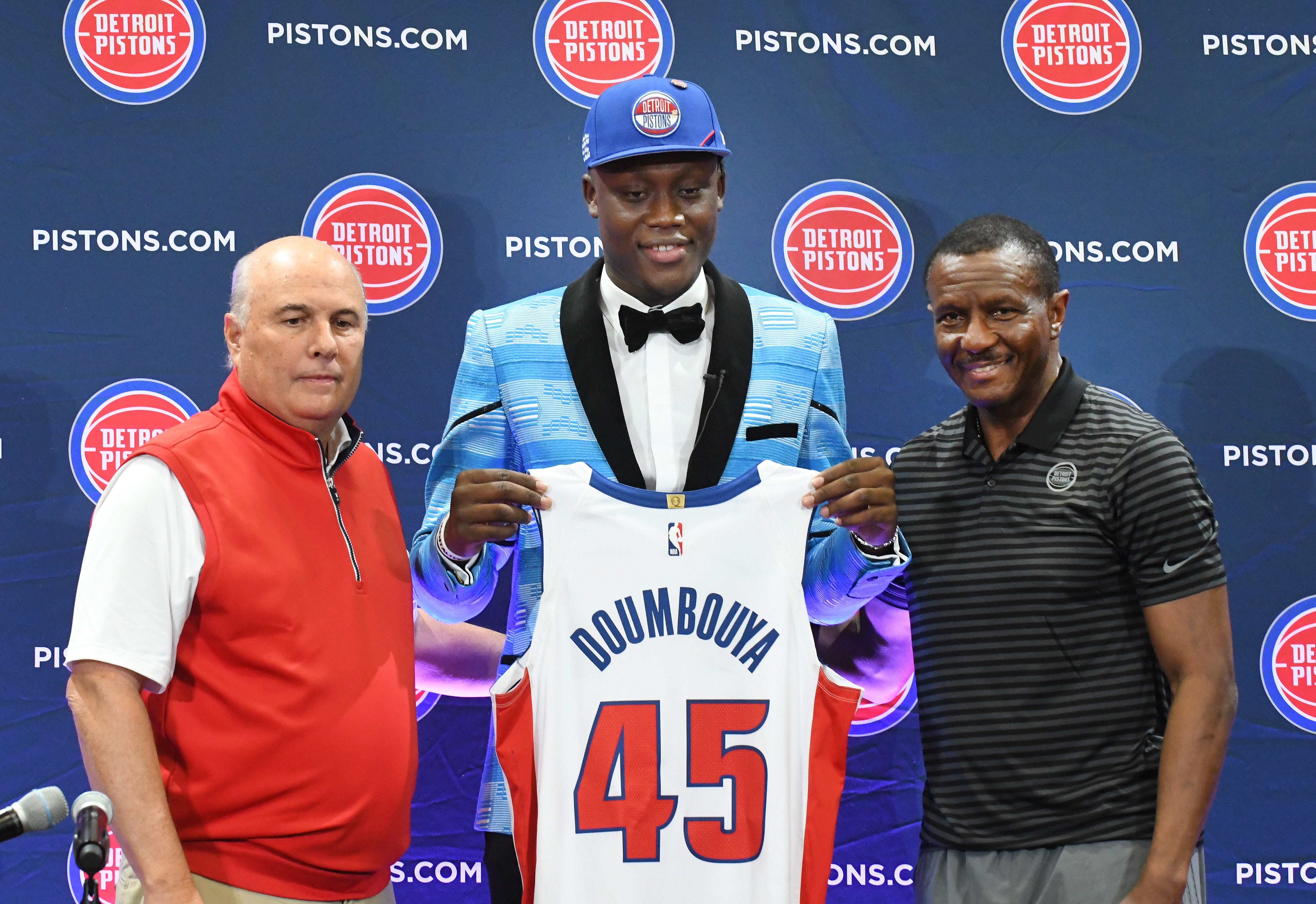Detroit Pistons senior advisor to owner Tom Gores Ed Stefanski, Pistons first round pick Sekou Doumbouya and Pistons head coach Dwane Casey pose for a photo during the press conference at the practice facility.
