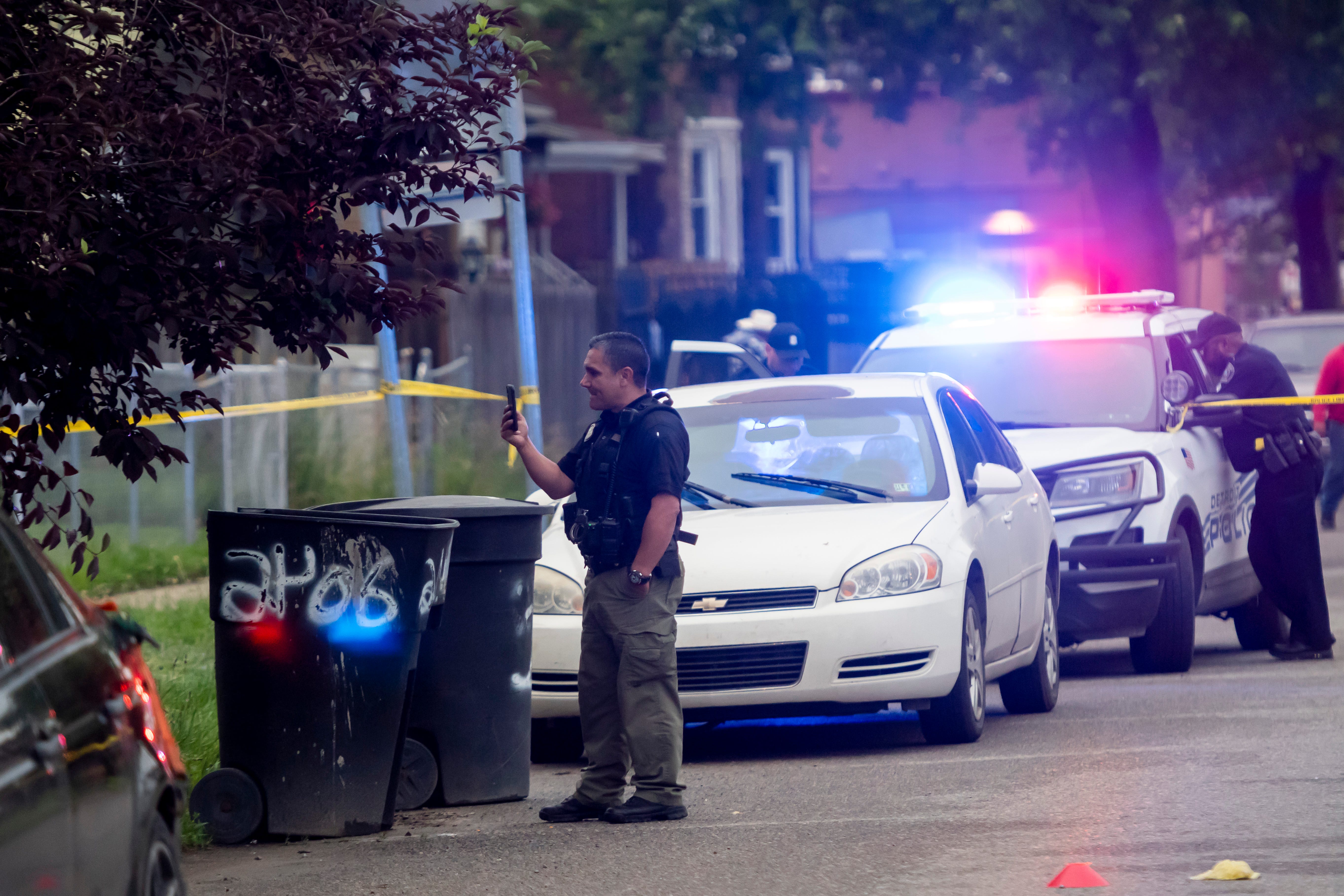 Detroit police investigate a shooting on the 2400 block of Honorah, in Detroit, June 20, 2019. The attempted robbery on the city's southwest side left the suspect dead and a 15-year-old seriously injured.