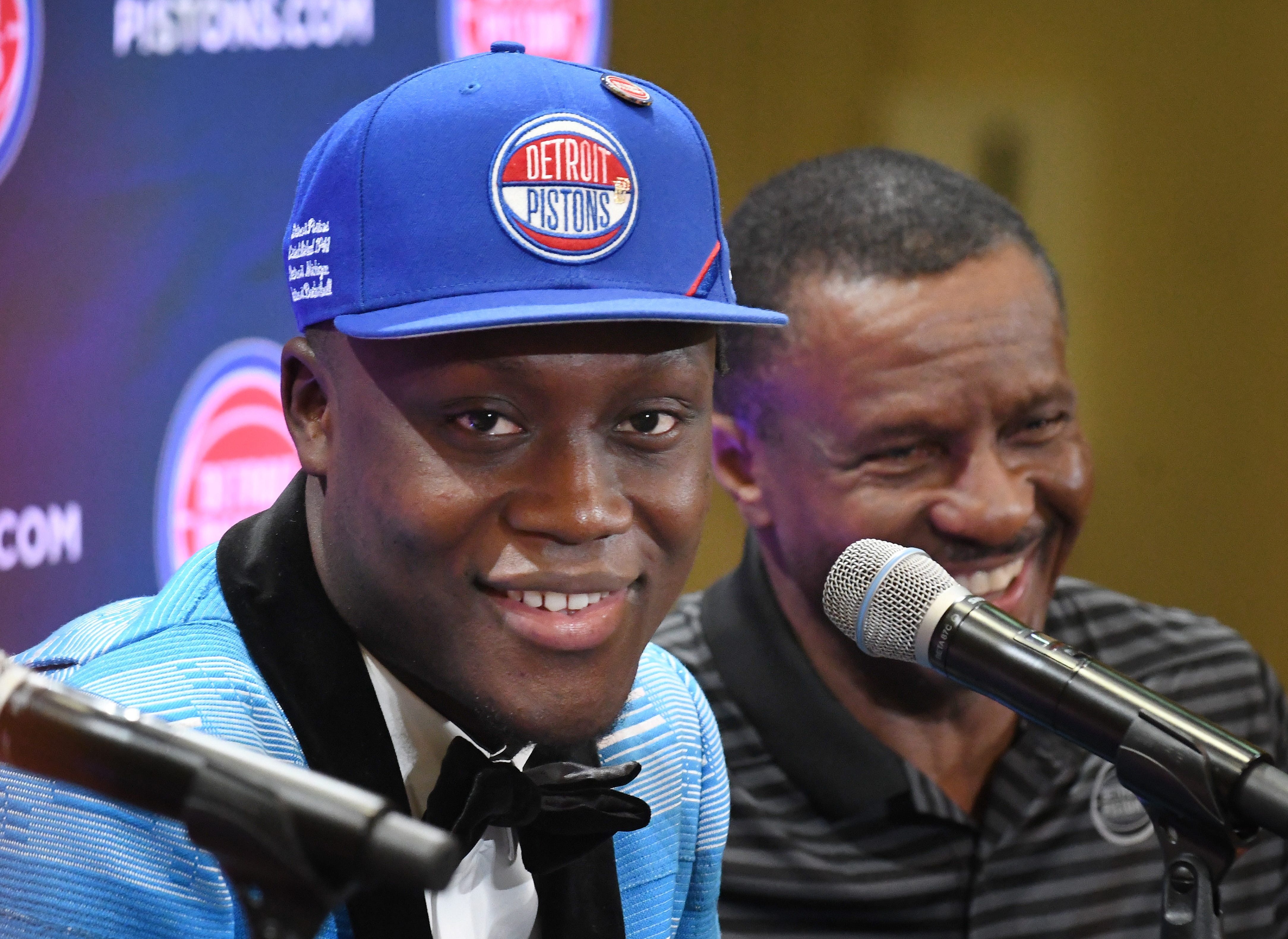 Pistons first round draft pick Sekou Doumbouya, with head coach Dwane Casey, addresses the media during a press conference at the practice facility in Auburn Hills, Michigan on June 21, 2019.