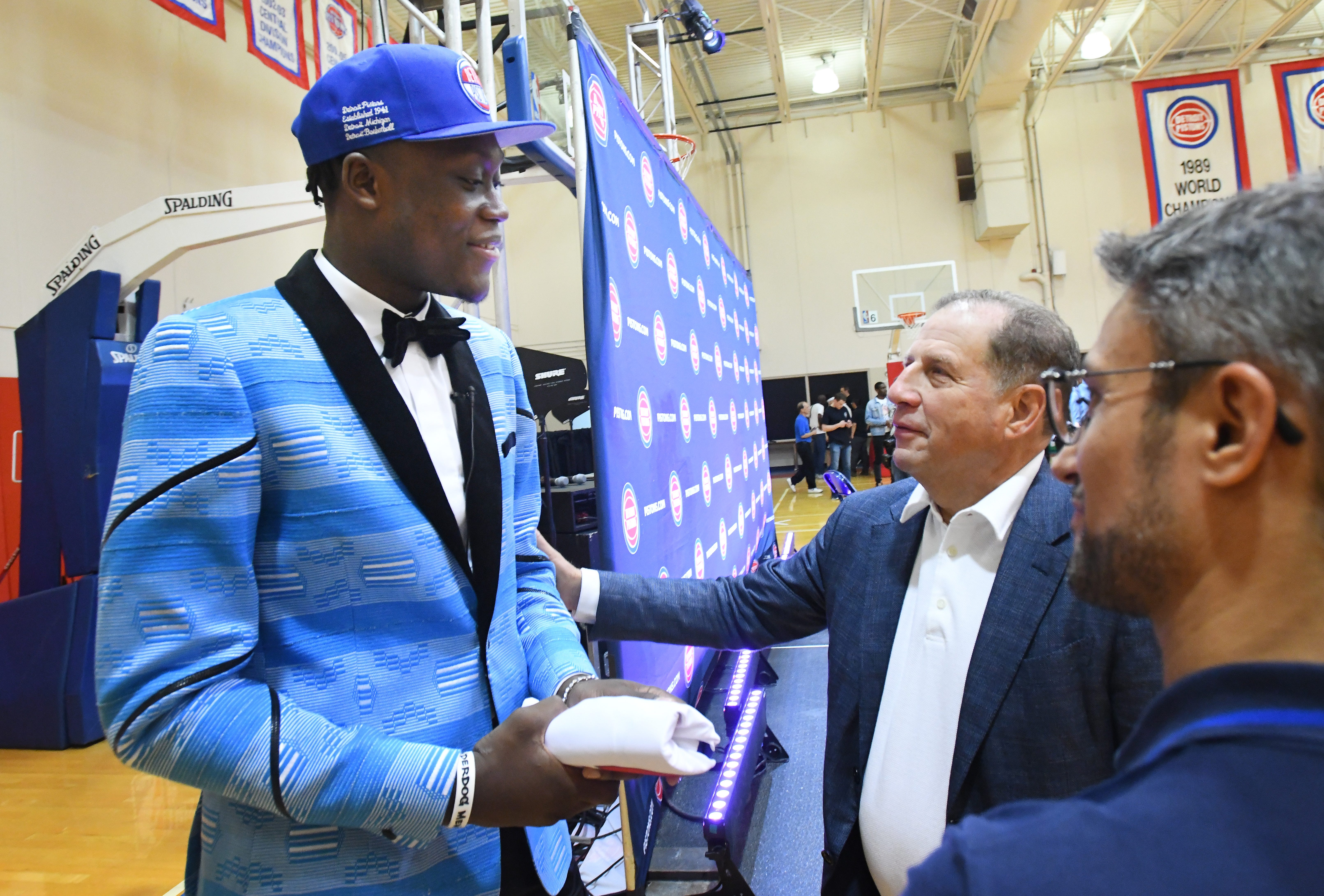 Pistons first round draft pick Sekou Doumbouya is greeted by Vice Chairman of Palace Sports & Entertainment Arn Tellem after the press conference.