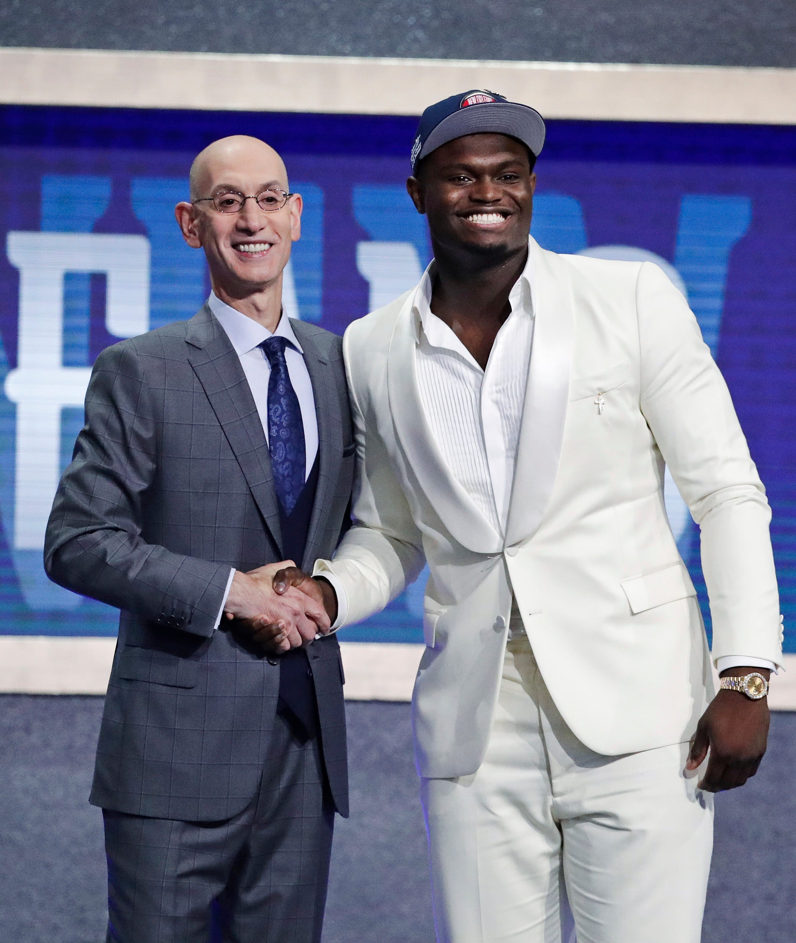 Duke's Zion Williamson, right, poses for photographs with NBA Commissioner Adam Silver after being selected by the New Orleans Pelicans with the first pick in the NBA Draft Thursday.