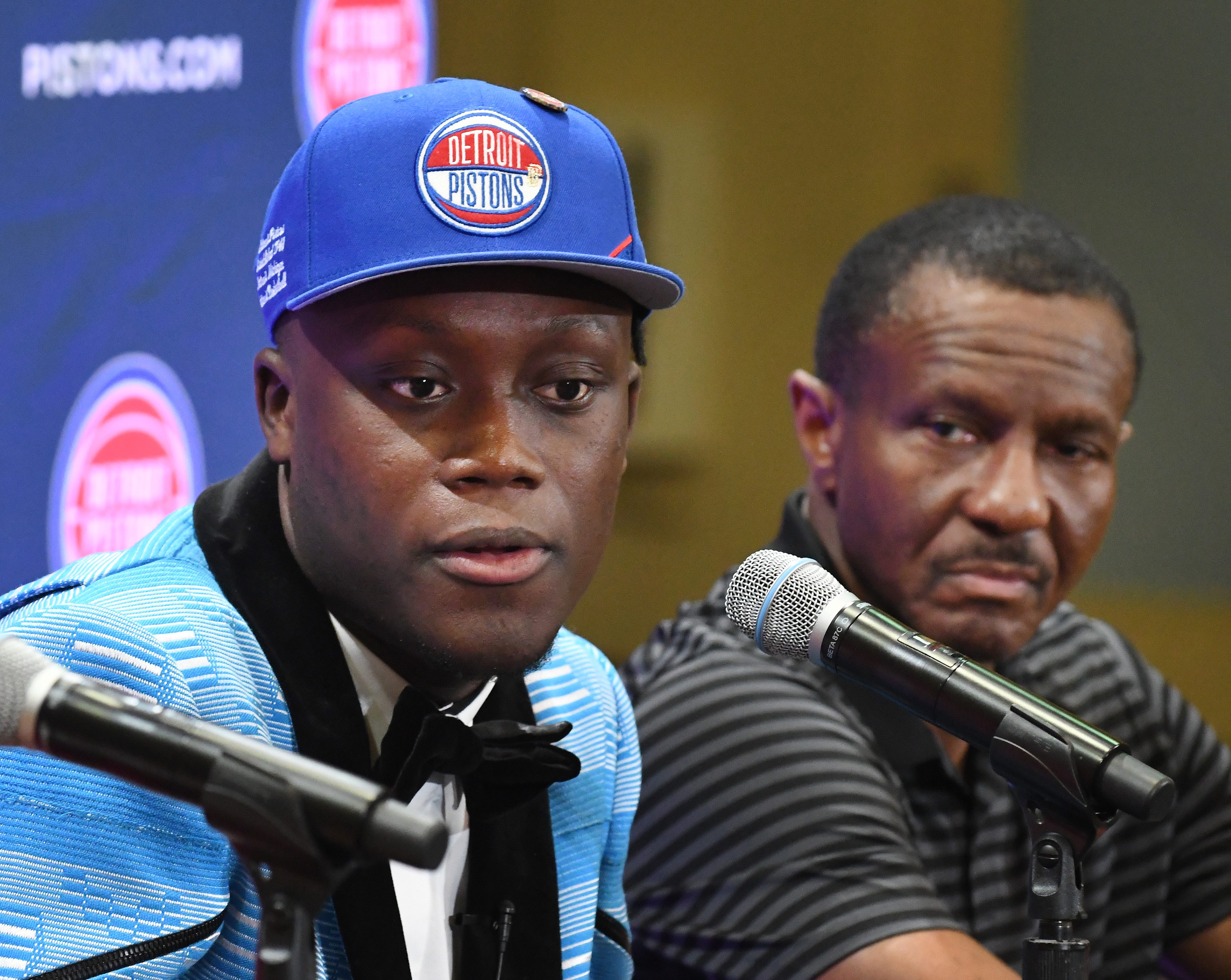 Pistons first round draft pick Sekou Doumbouya, with head coach Dwane Casey, addresses the media during a press conference.