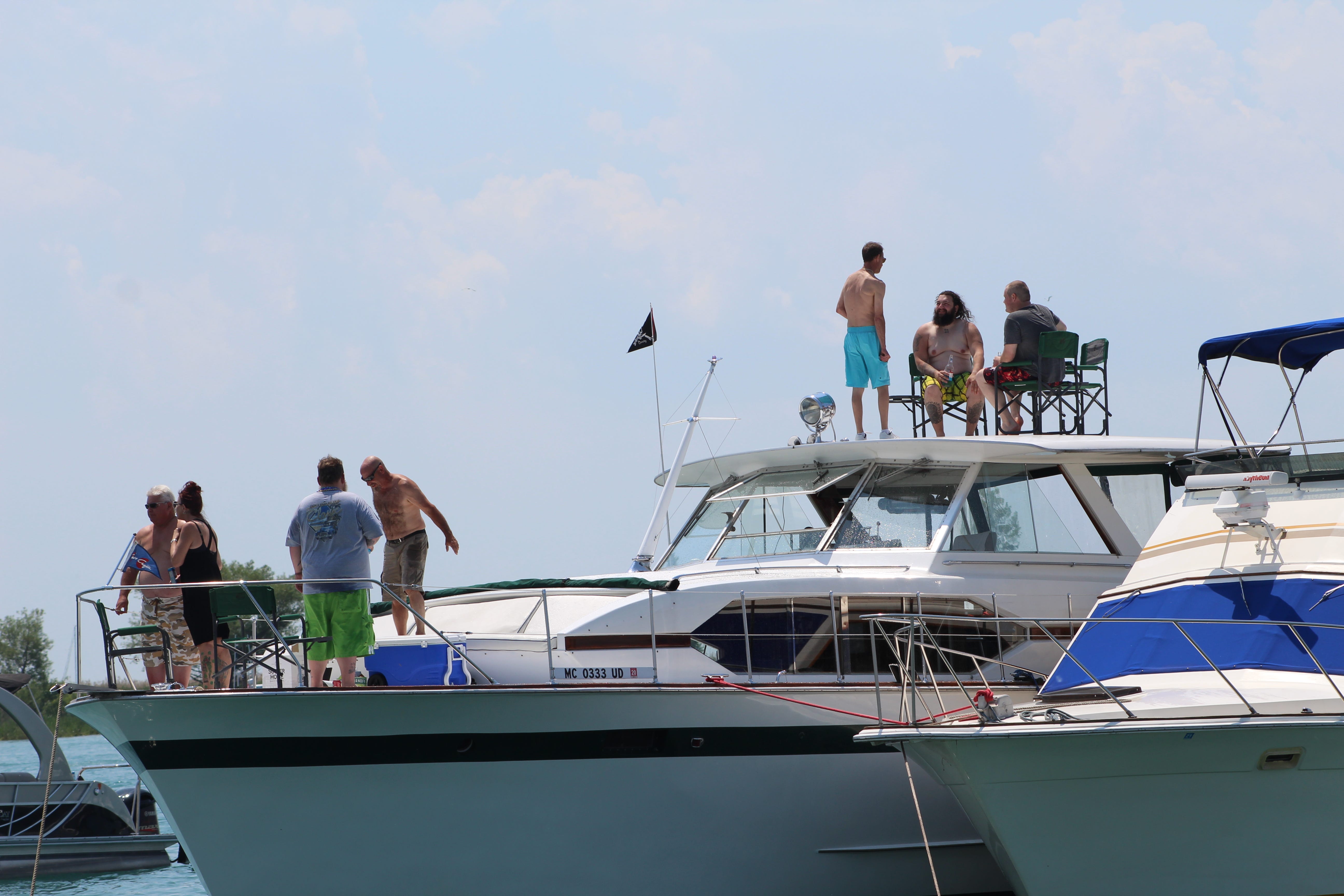 Jobbie Nooner revelers hang out on pleasure craft boats around Gull Island on Lake St. Clair, Friday, June 28, 2019.
