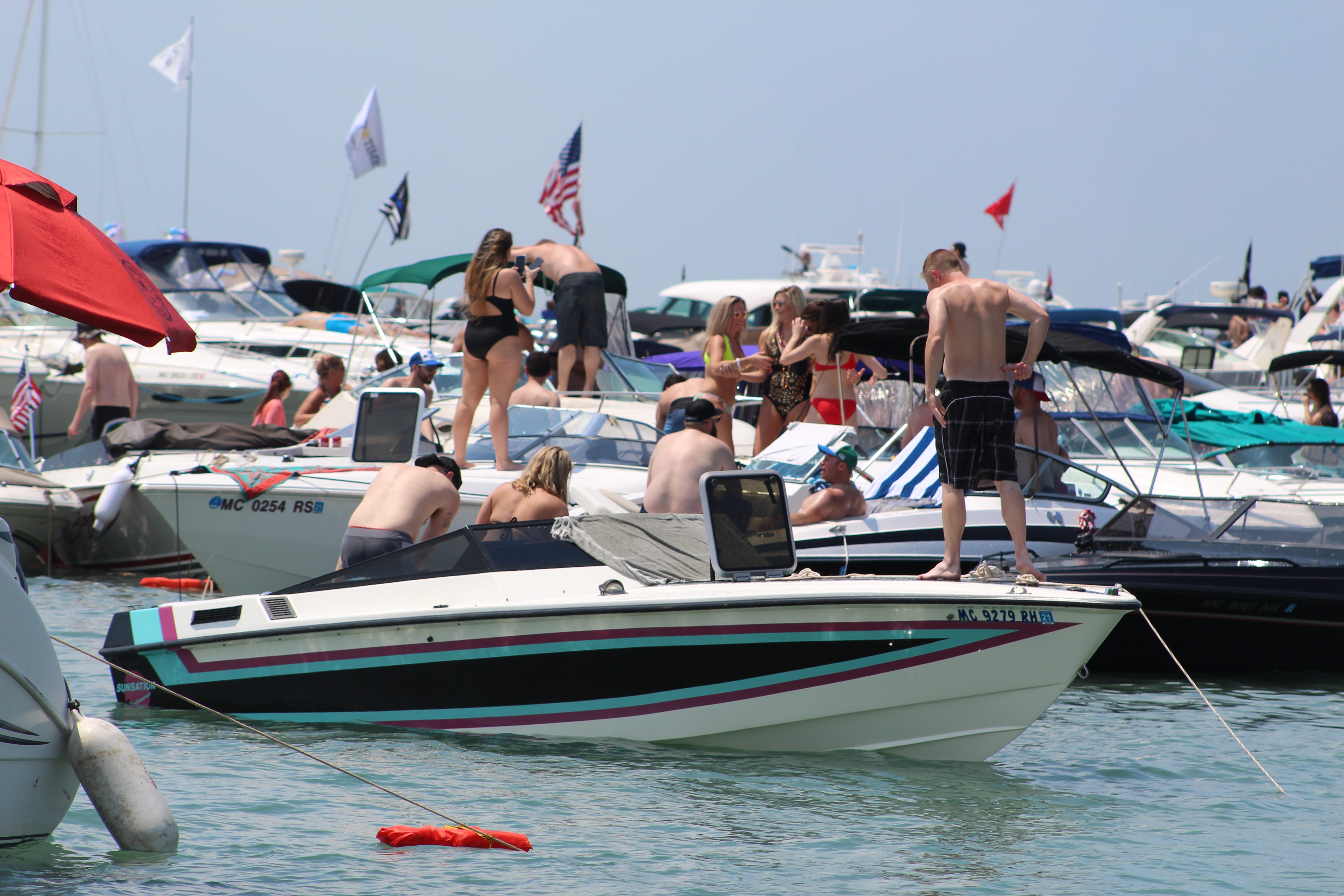Jobbie Nooner revelers hang out on pleasure craft boats around Gull Island on Lake St. Clair, Friday, June 28, 2019.