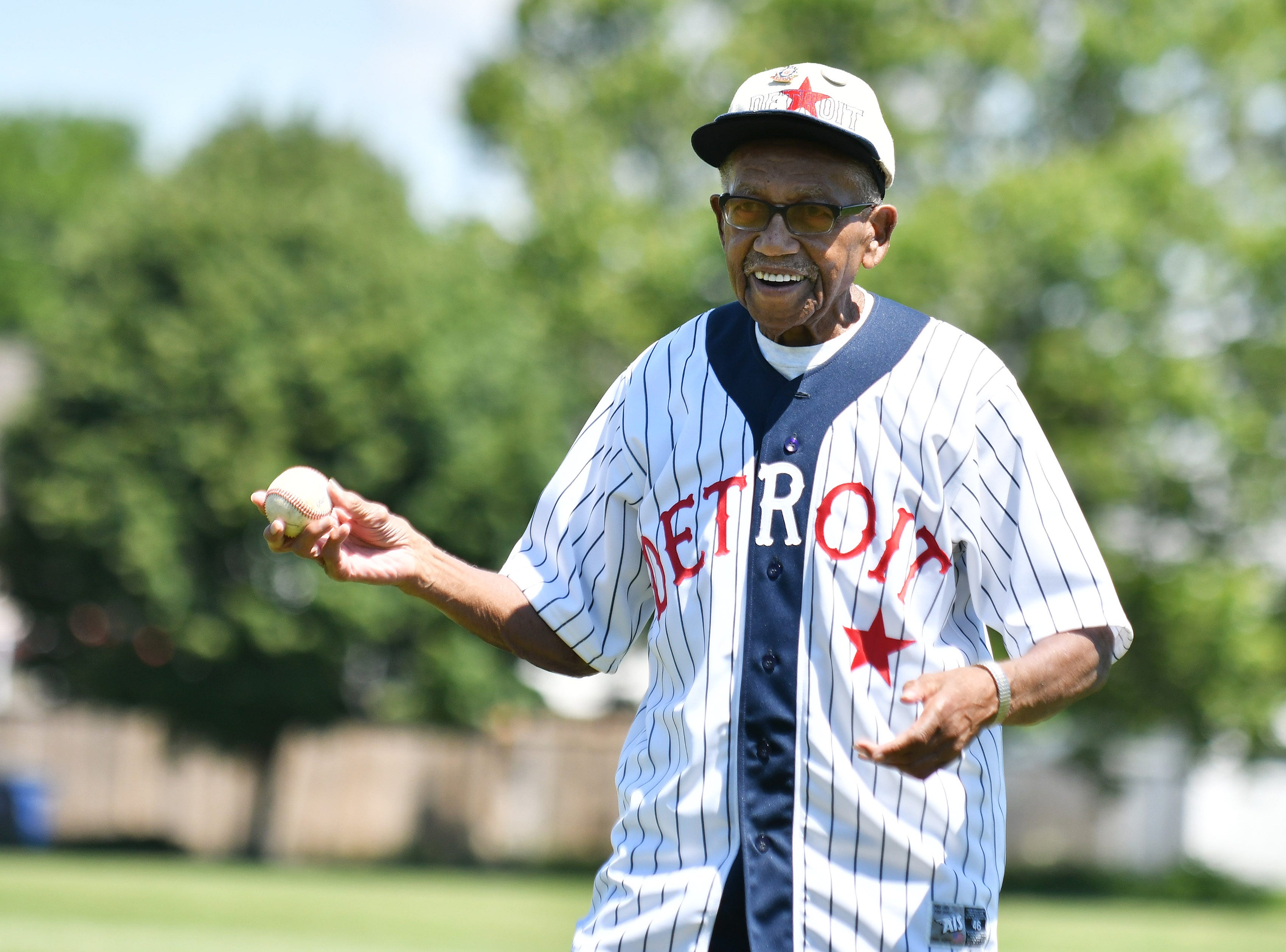 Ron Teasley, 92, of Detroit, who played in the Negro League, about to throw out the ceremonial first pitch.