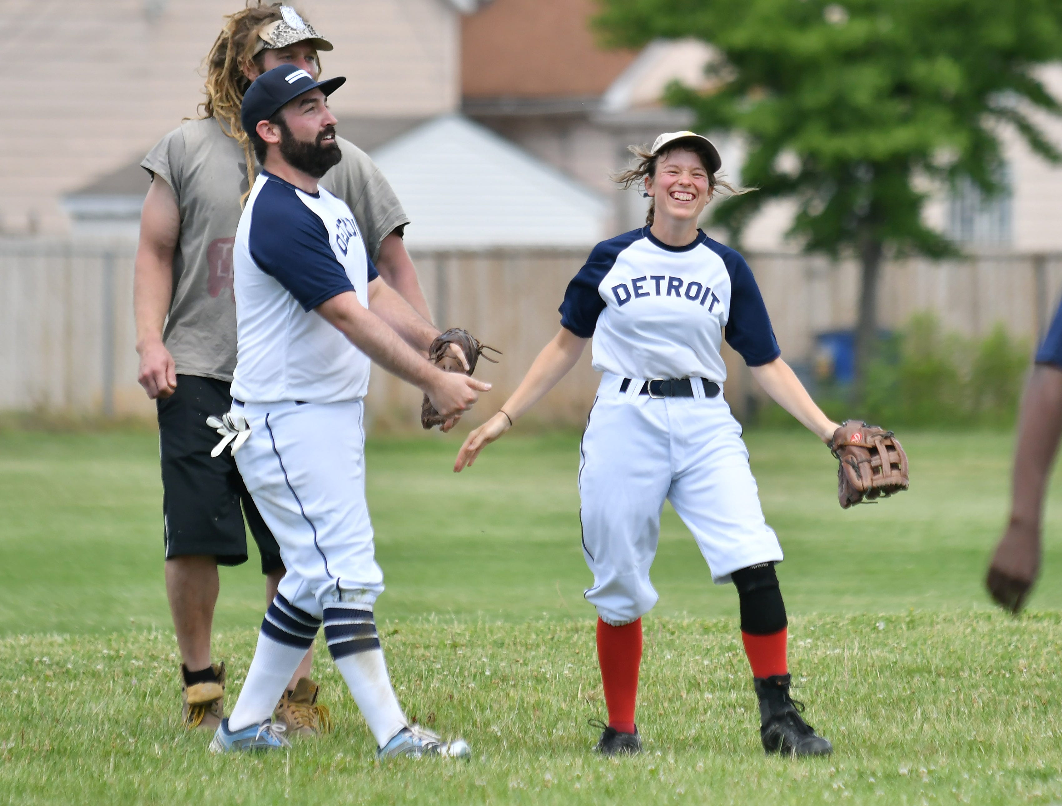 Tony Paris of Hamtramck and Lou Setzler, 32, of Detroit react after a successful run down getting the out on the Warstic baserunner.