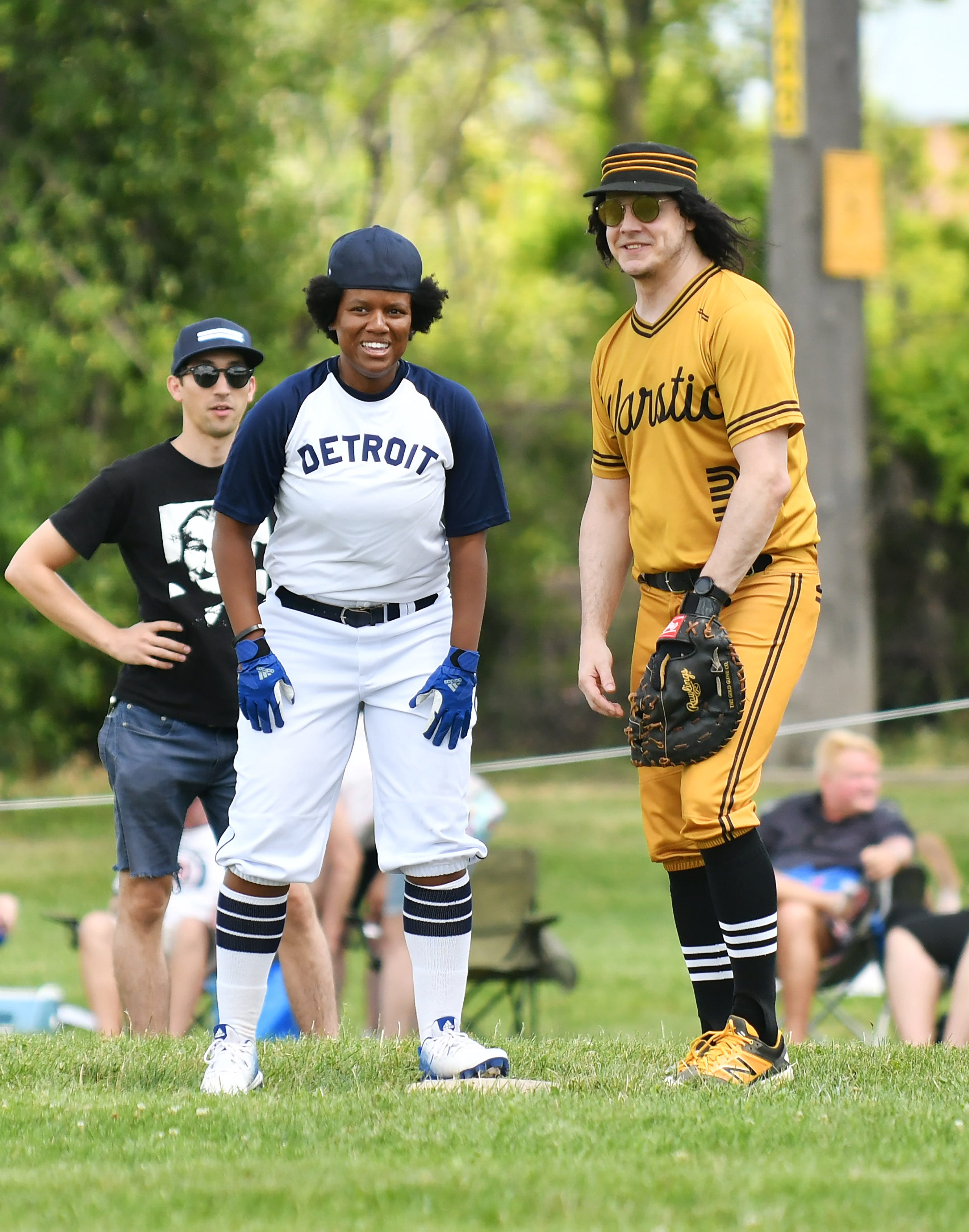 Jack White, right, chats with Vanessa Rose, 36, of Royal Oak, granddaughter of Norman "Turkey" Stearnes, after she reaches first base. Stearnes, a Hall of Famer, played 11 seasons for the Detroit Stars Negro League team.