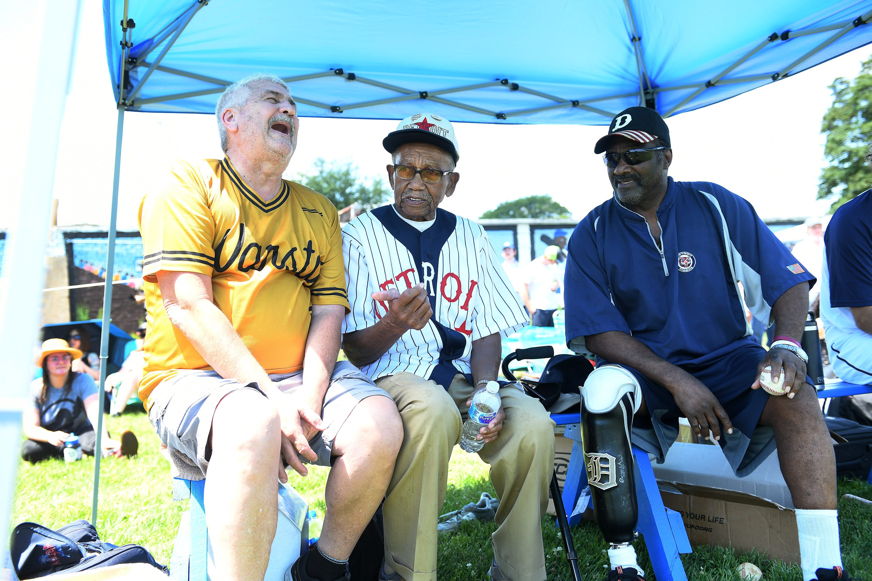 From left, Pete Celina laughs at a comment made by Ron Teasley, 92, of Detroit, who played in the Negro League, and Ike Blessitt at Hamtramck Stadium during a charity match with the Jack White and friends to benefit the Friends of Historic Hamtramck Stadium on July 11, 2019. Blessitt played with the Detroit Tigers and many years in Mexico.