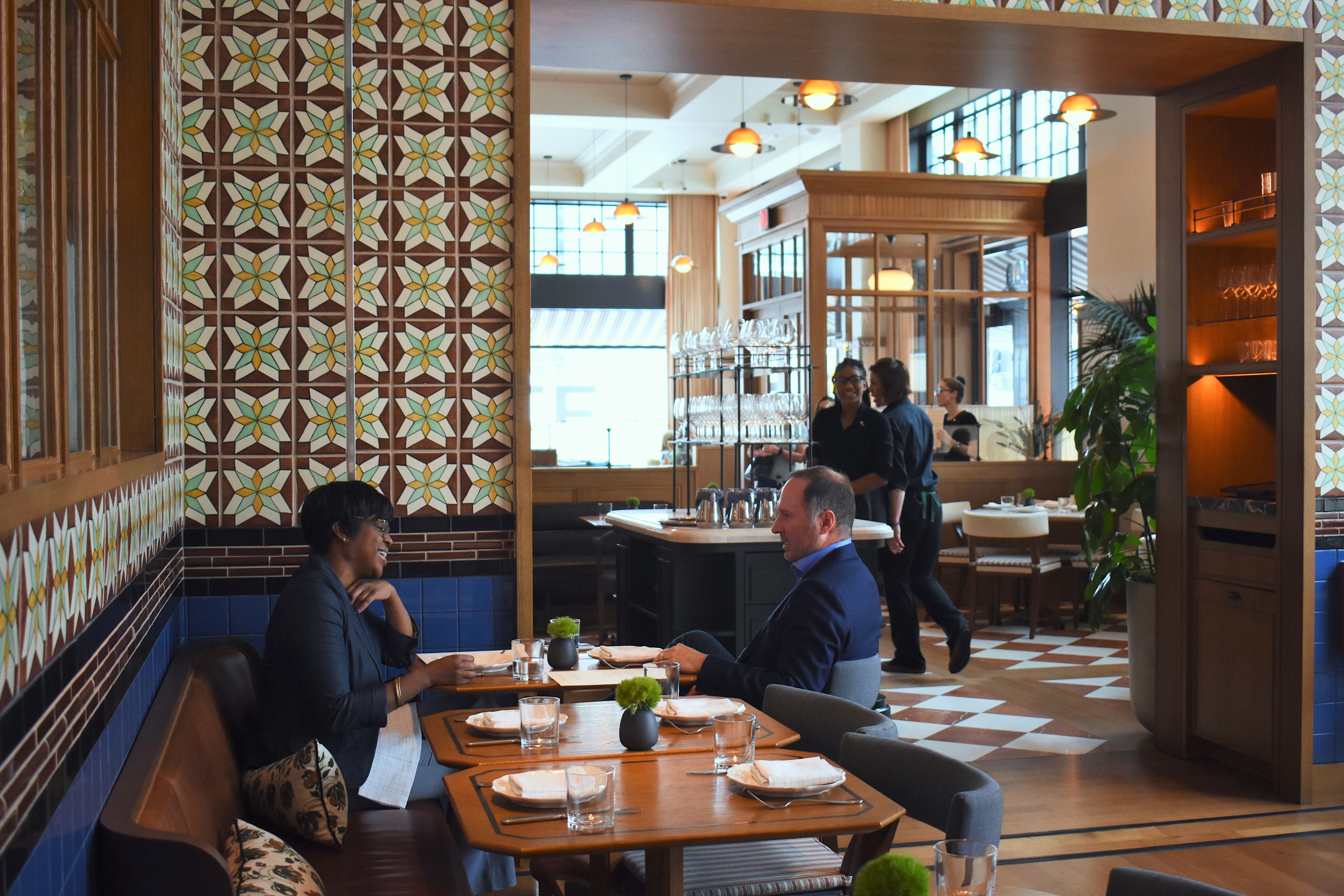 Jamila Thompson, left, of Detroit, shares a laughter-filled lunch with Troy Larson, of Birmingham, at the new Italian eatery San Morello, inside the Shinola Hotel in Detroit.