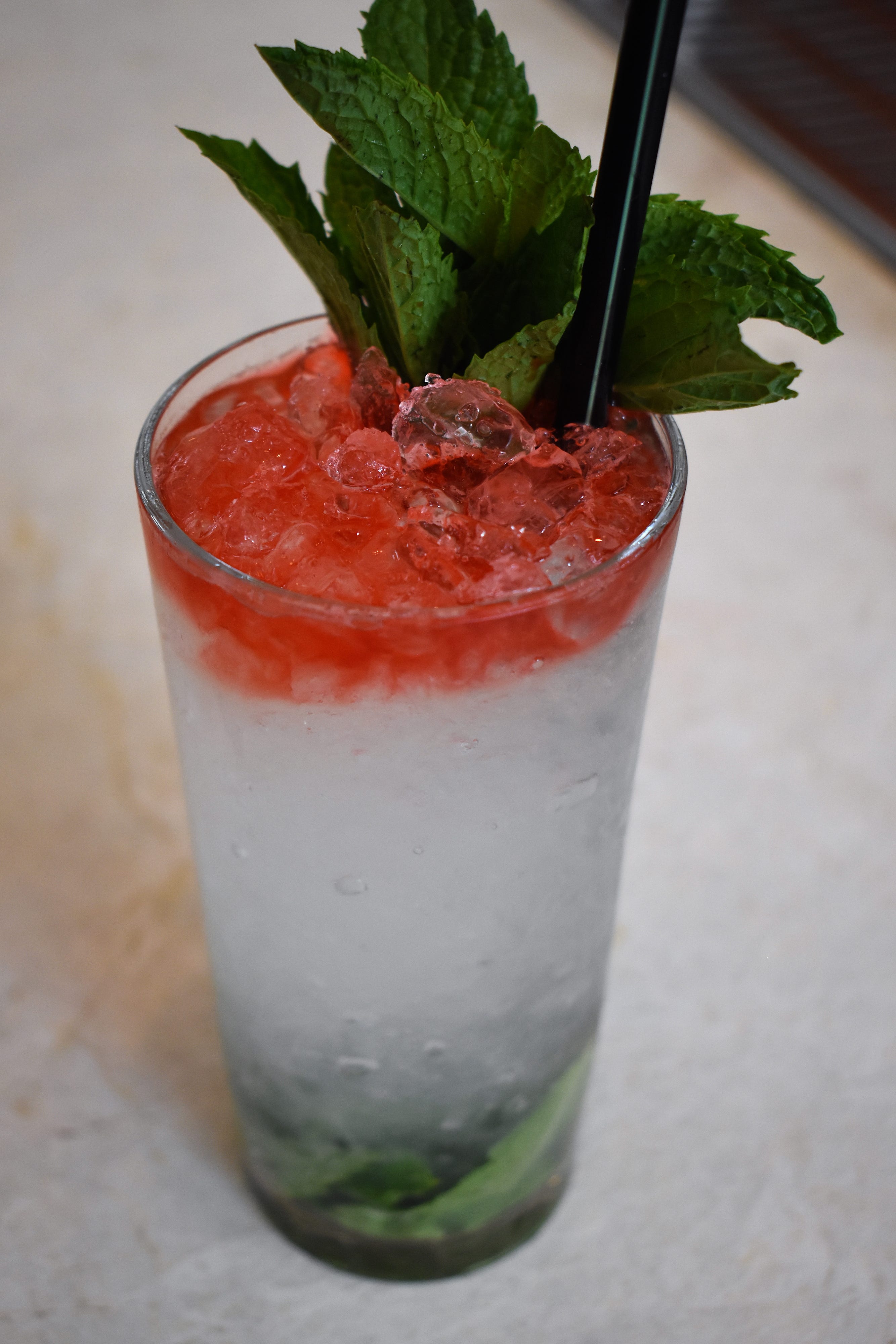 One of the house cocktails is called the "Tricolore Spritz," a mixture of lime, mint,  cucumber syrup, gin, Prosecco and Peychaud’s bitters that bears the same colors as the Italian flag.