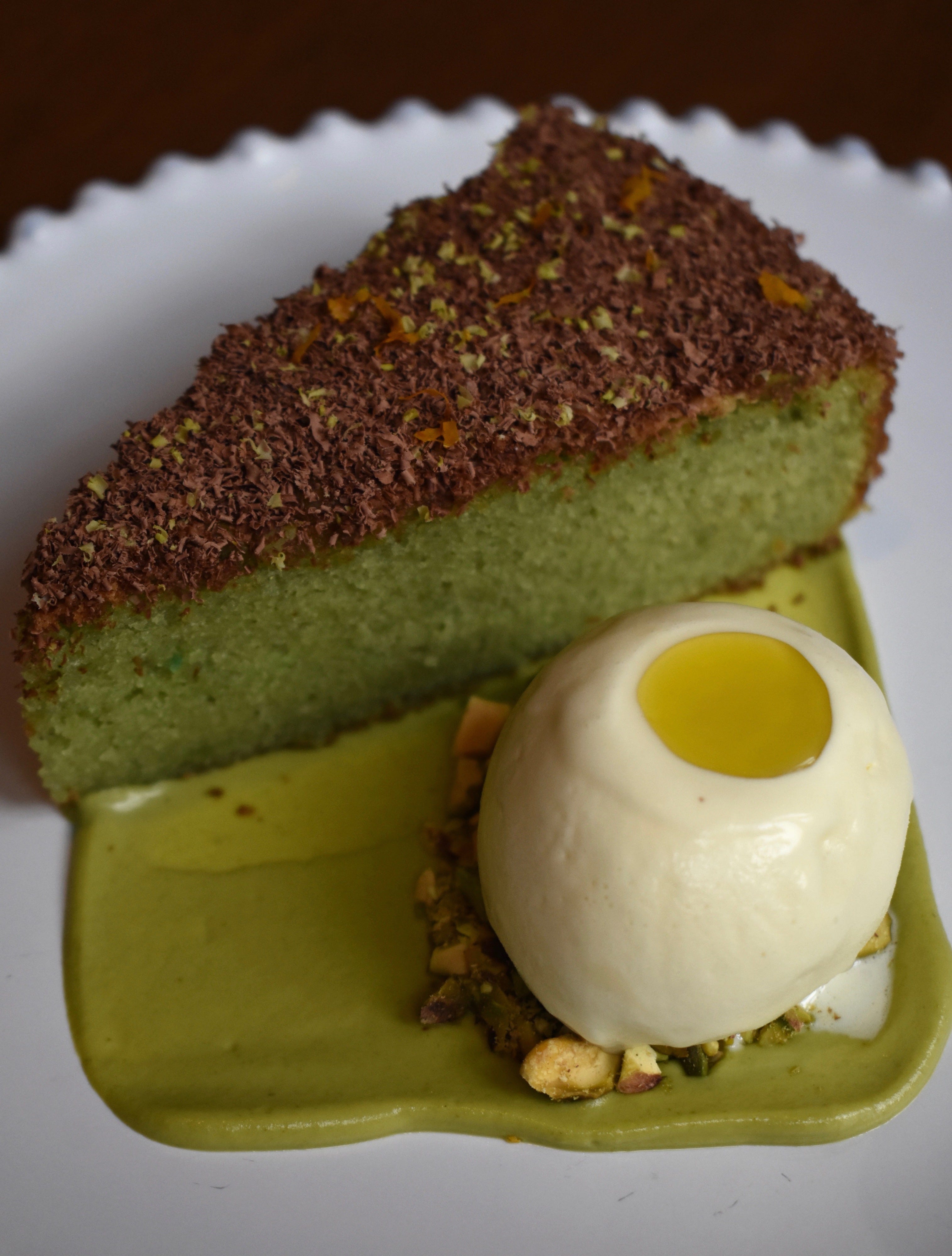 A Sicilian pistachio cake is paired with an olive oil gelato which is itself crowned with a dollop of the liquid gold.