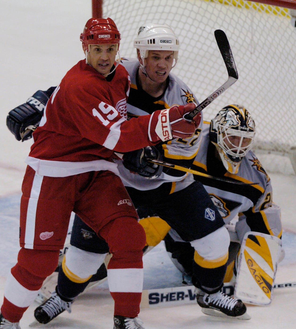 Greg Johnson, here battling with Steve Yzerman in front of the net, was traded to Pittsburgh by Detroit in 1997.