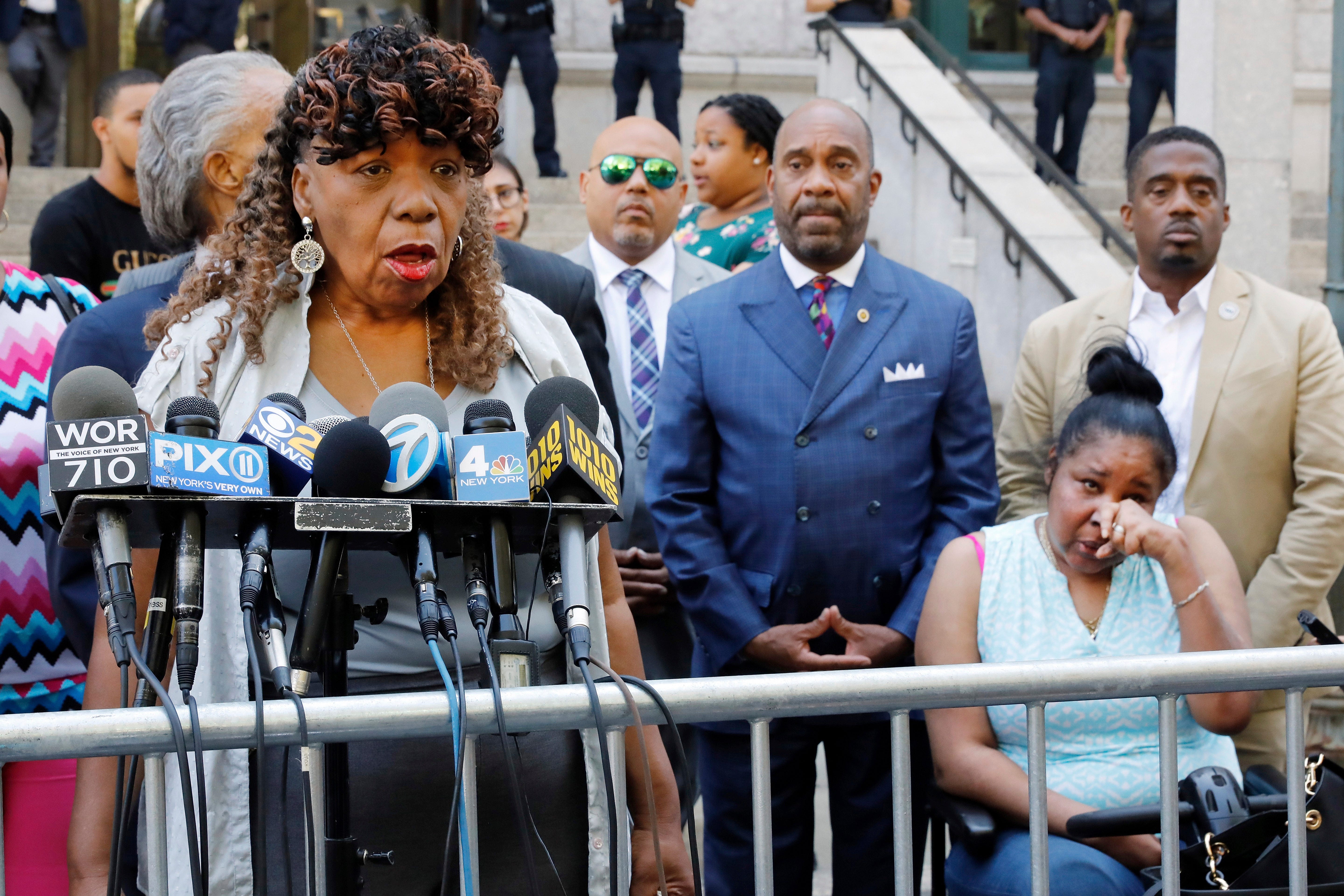 Gwen Carr, mother of chokehold victim Eric Garner, left, speaks outside the U.S. Attorney's office, in the Brooklyn borough of New York, as Garner's widow Esaw Snipes listens at right, Tuesday, July 16, 2019.