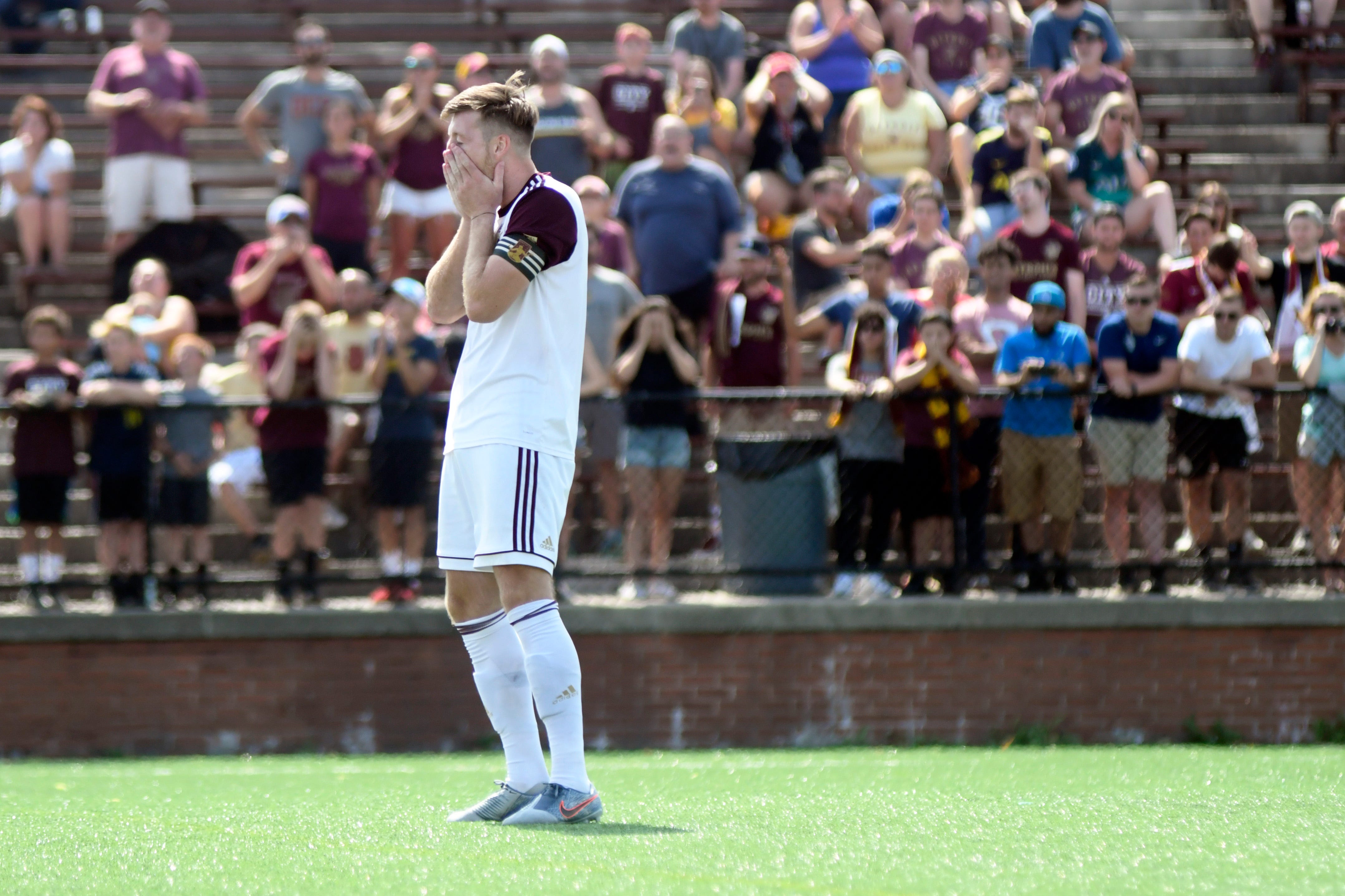 Detroit City FC's Stephen Carroll reacts after missing his penalty shot against Cleveland SC.