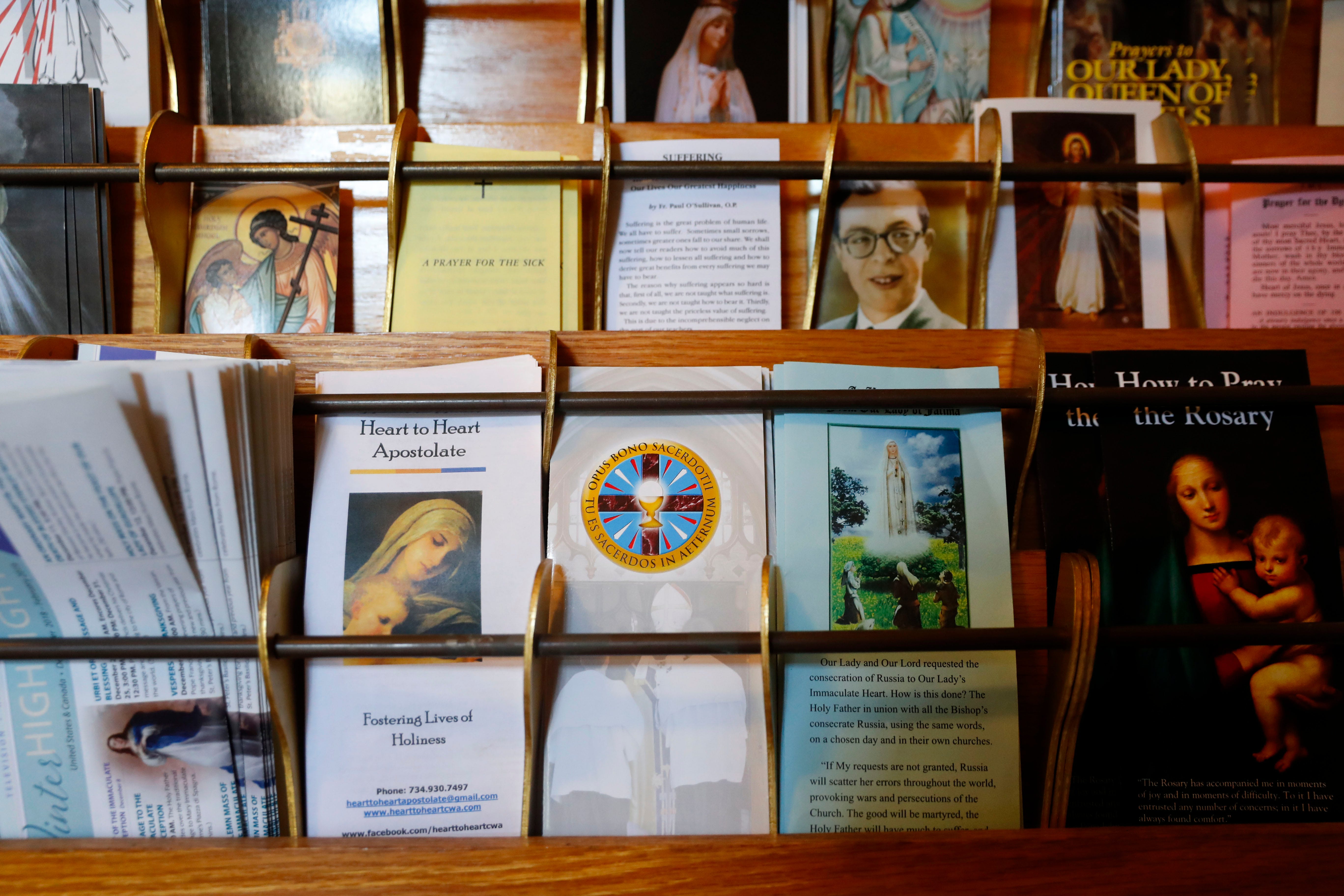 Informational pamphlets for Opus Bono Sacerdotii are displayed with others at The Assumption of the Blessed Virgin Mary Church in Detroit on June 7.