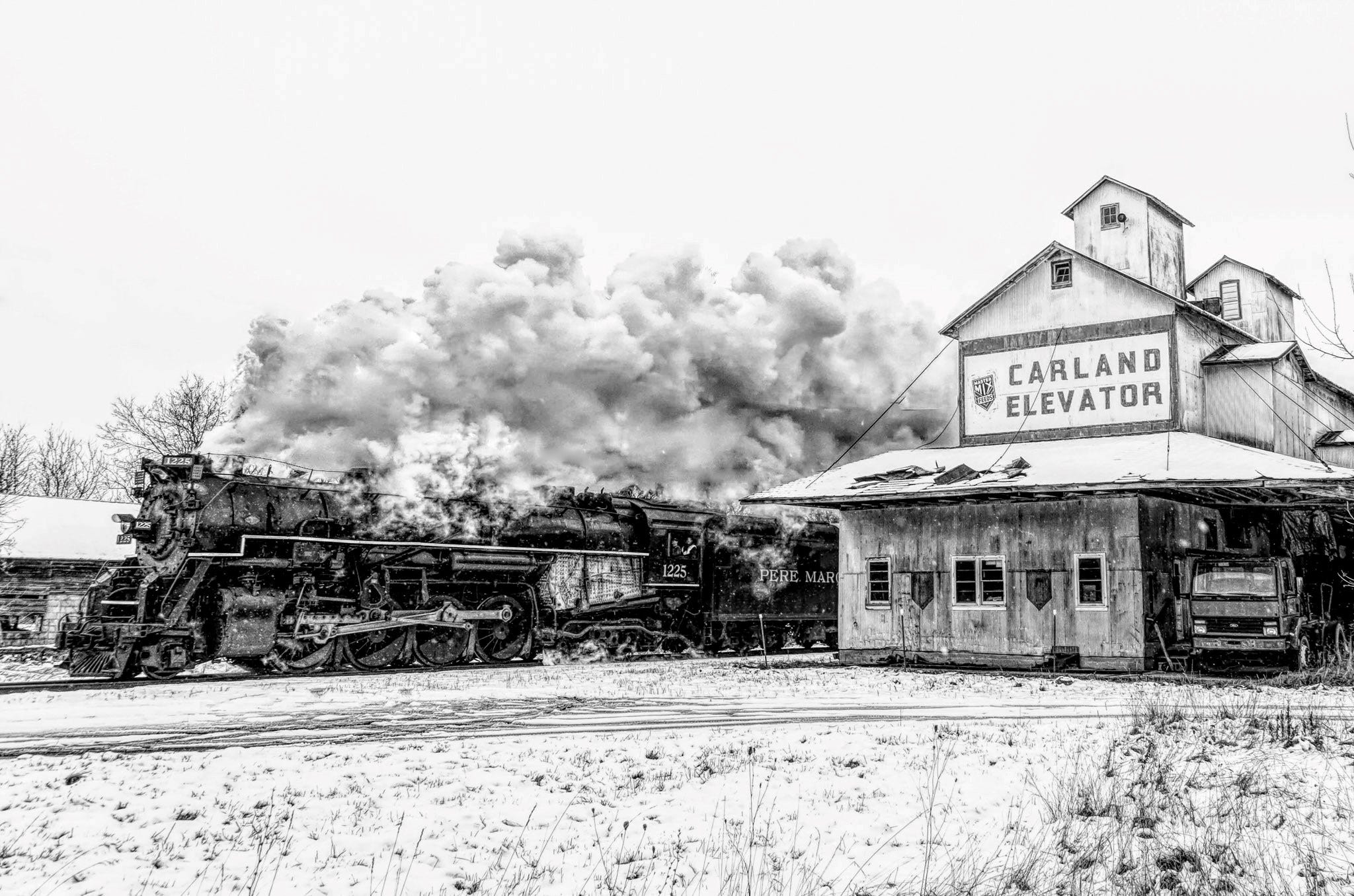 " Each holiday season our local camera club travels to the Owosso area to photograph this 1940s era steam locomotive, " said Glen Suszko of Shelby Twp. " This picture was taken as The Polar Express ( aka Pere Marquette 1225 ) steamed past the grain elevator in Carland, Michigan. As it rolls by, the sight, sound and feel of this train engine is a breathtaking experience.