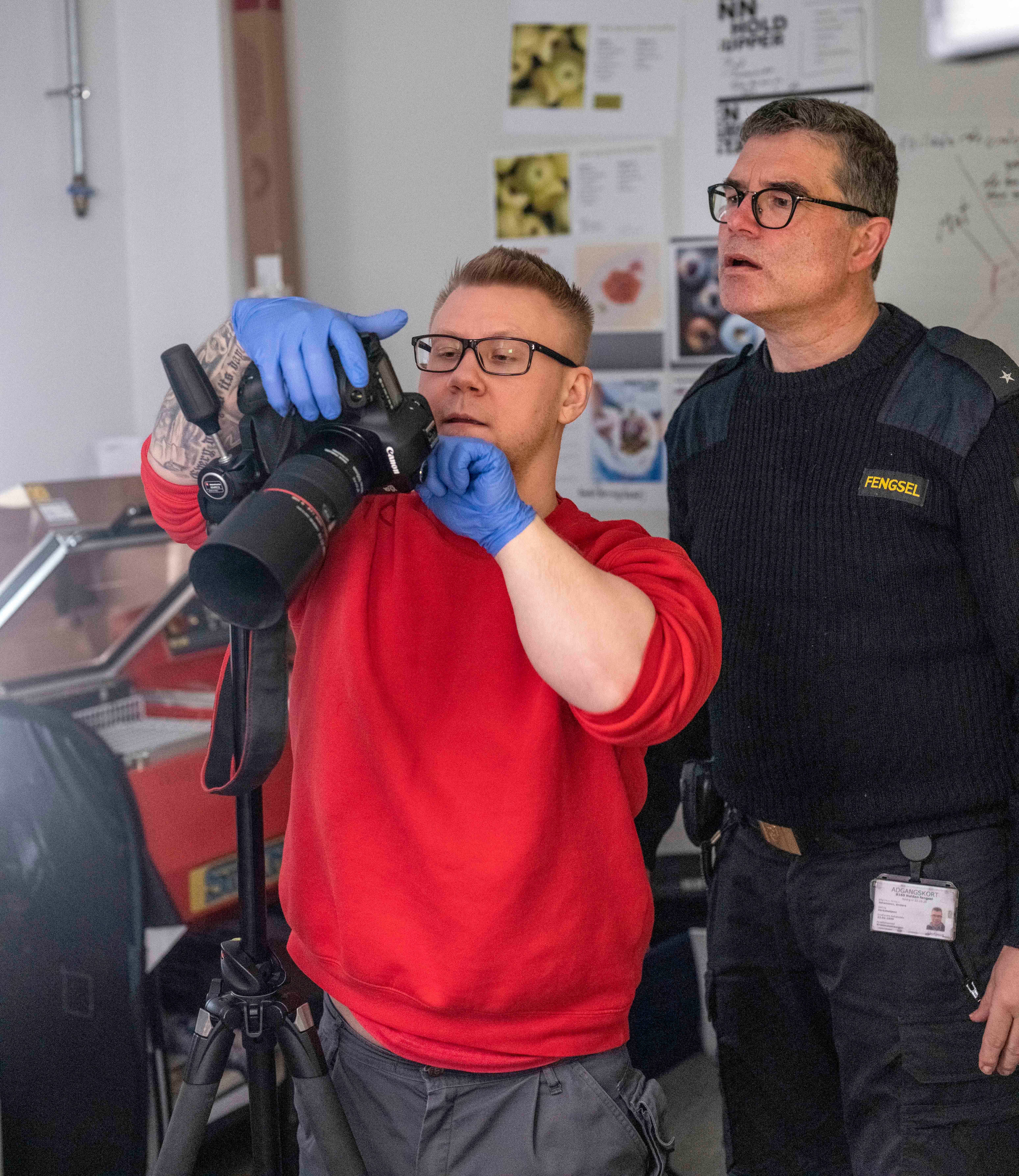 Inmate Kim, left, and works officer Anders Johansson prepare to shoot a photograph in the print shop at Halden Prison in Norway.