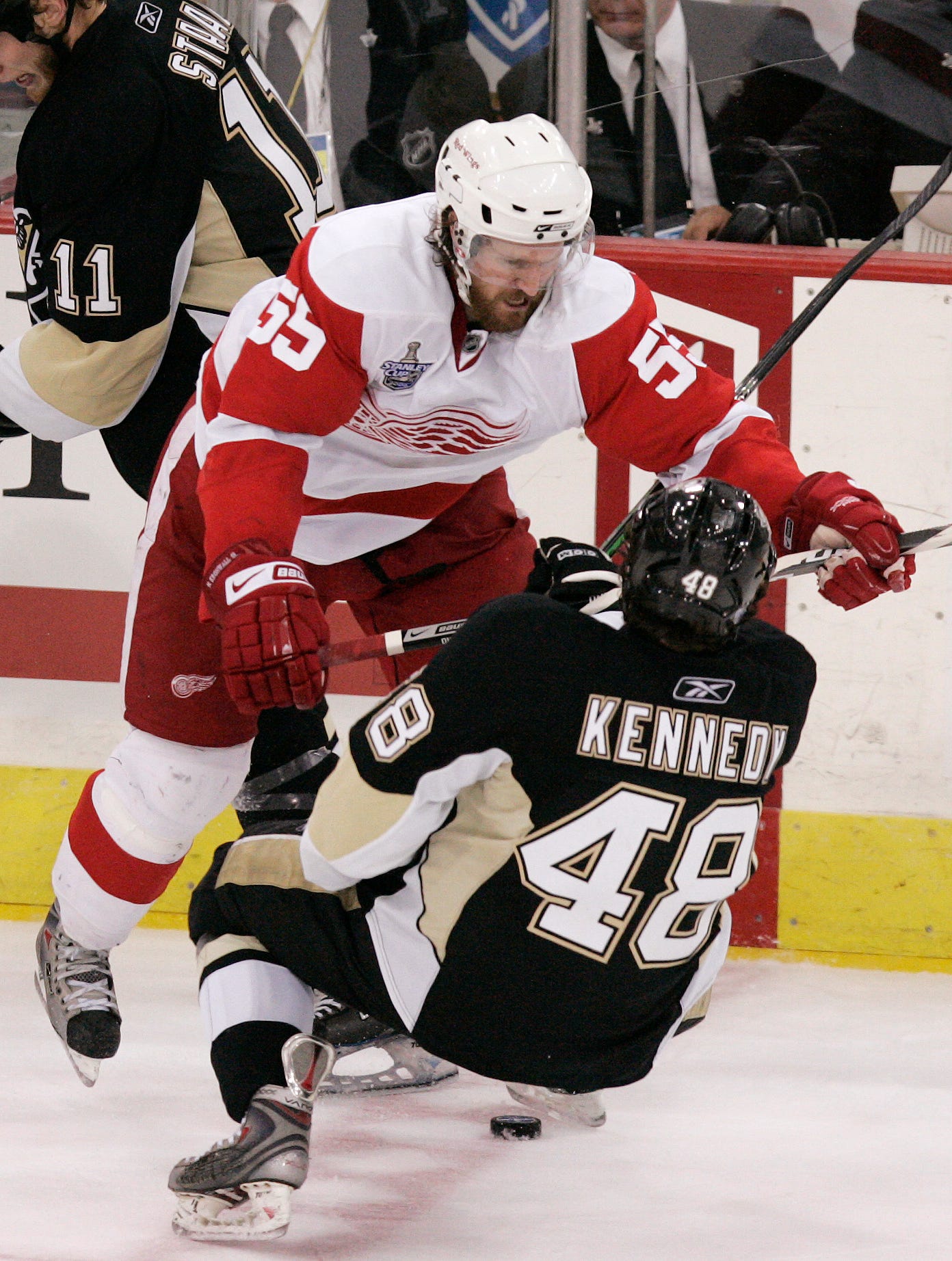Detroit Red Wings defenseman Niklas Kronwall puts a nasty open-ice check on Pittsburgh Penguins center Tyler Kennedy during a 2-1 Red Wings victory in Game 4 of the Stanley Cup Finals at Mellon Arena in Pittsburg on Saturday, May 31, 2008.
