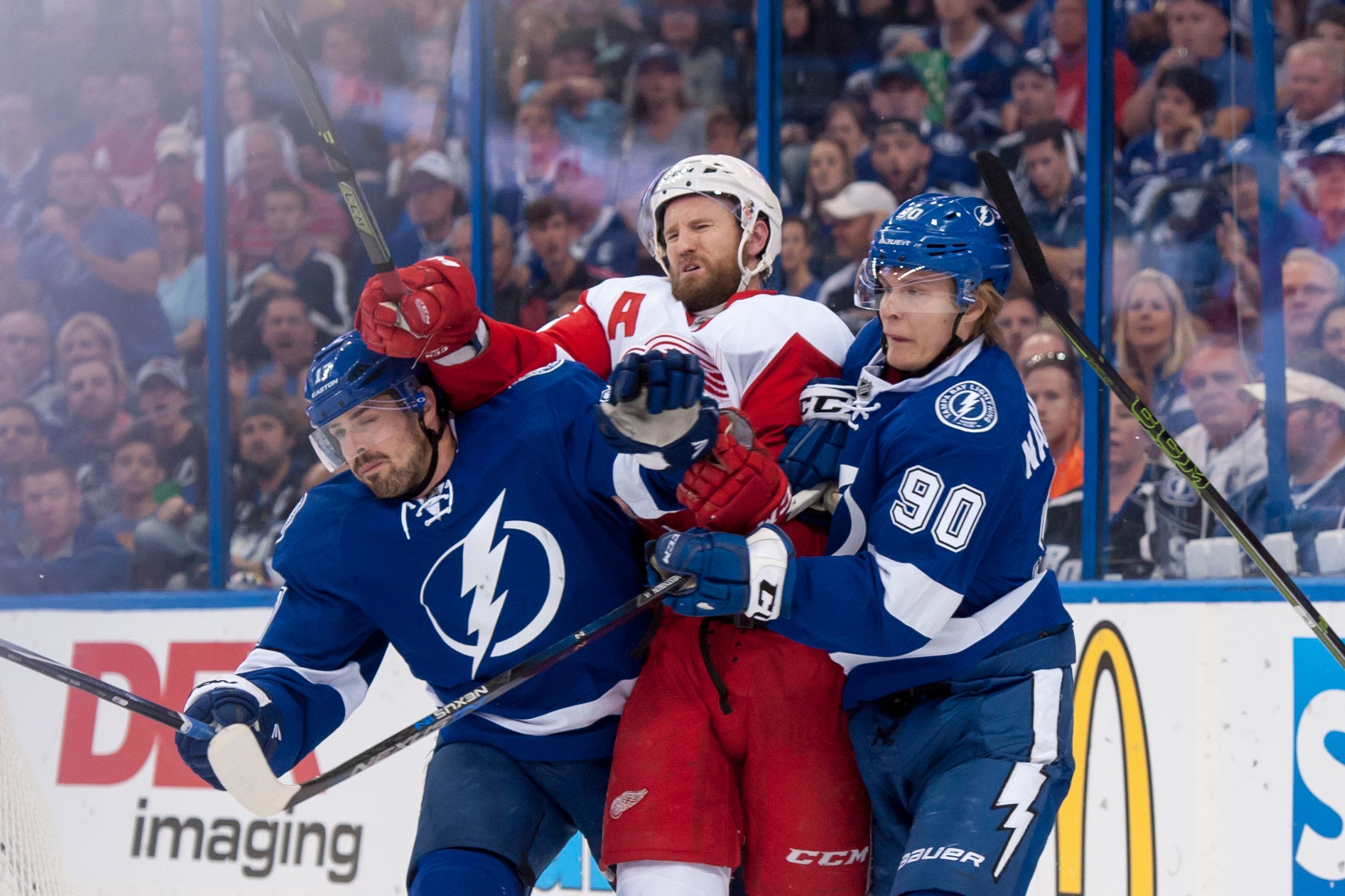 Detroit defenseman Niklas Kronwall is squeezed by Tampa Bay center Alex Killorn, left, and center Vladislav Namestnikov during Game 5 of the Eastern Conference semifinals at Amalie Arena in Tampa, Florida on April 21, 2016.