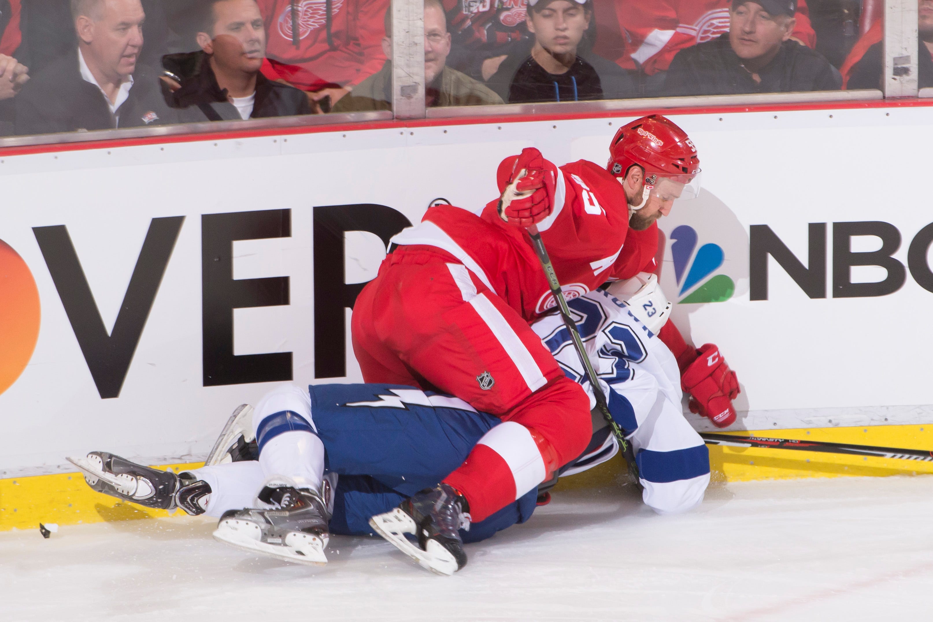 Detroit defenseman Niklas Kronwall buries Tampa Bay right wing J.T. Brown with a check during a game at Joe Louis Arena in Detroit on Oct. 13 , 2015.