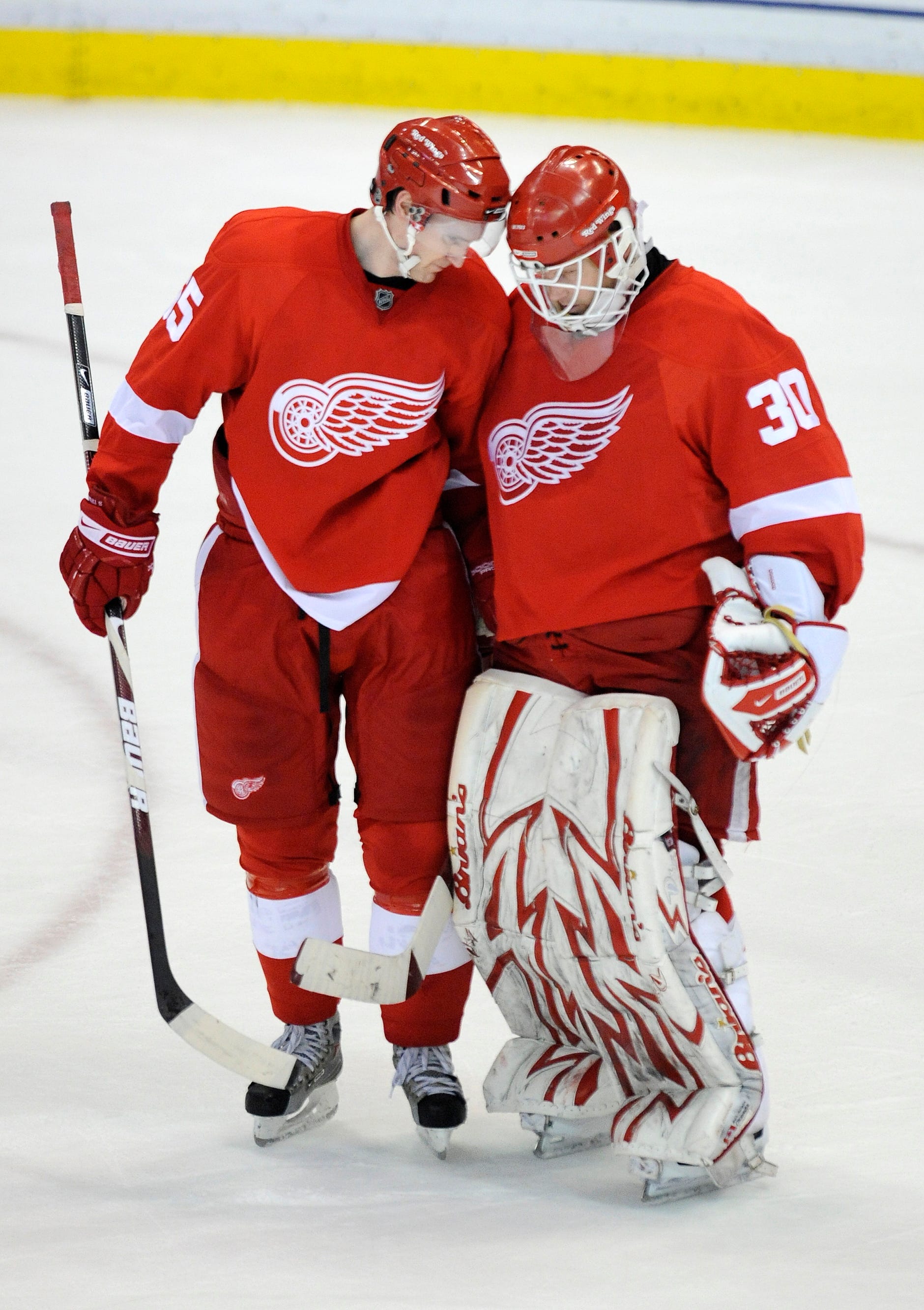 Detroit Red Wings defenseman Niklas Kronwall congratulates goalie Chris Osgood after a 4-1 victory over the Columbus Blue Jackets in Game 1 of the Eastern Conference quarterfinals at Joe Louis Arena on April 16, 2009.