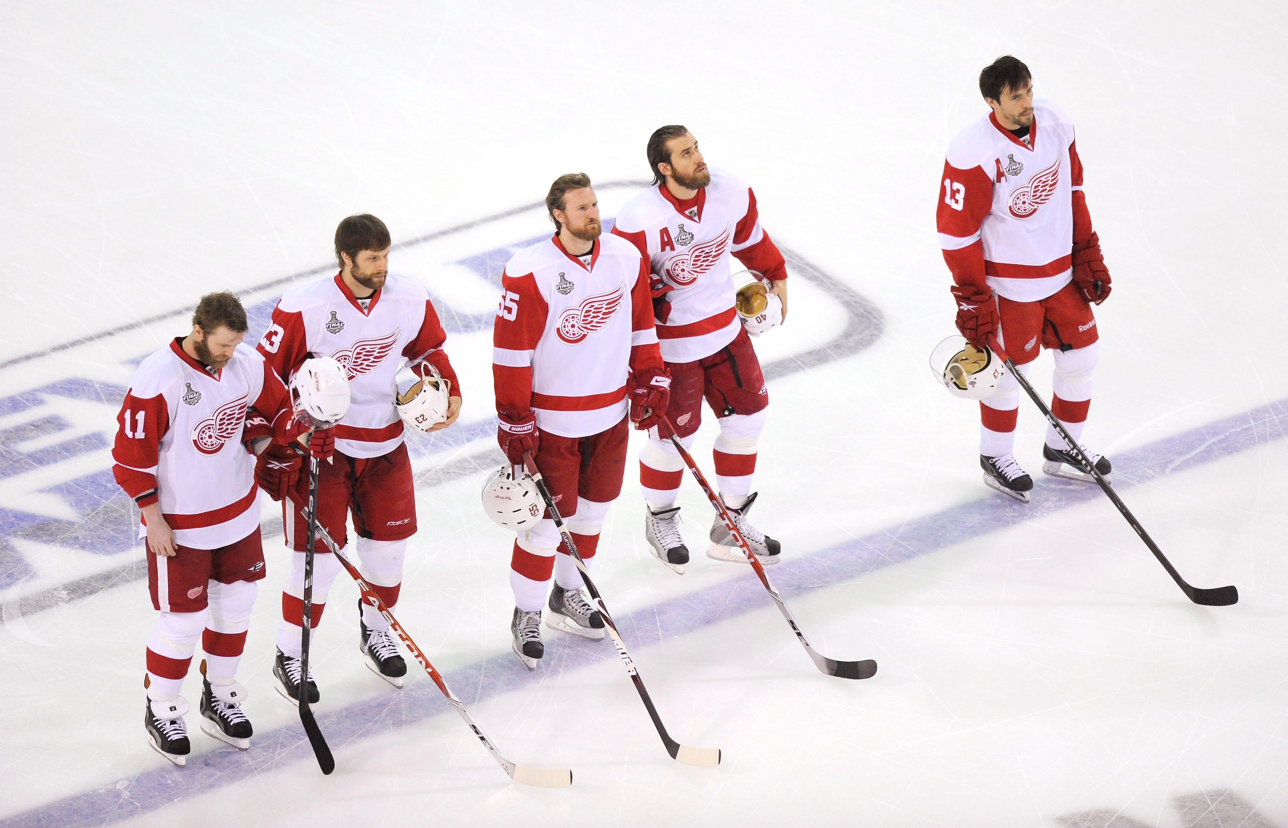 From left, Detroit Red Wings ' Daniel Cleary, Brad Stuart, Niklas Kronwall, Henrik Zetterberg and Pavel Datsyuk stand for the national anthem during the pregame of a Stanley Cup Finals game in Pittsburgh on June 9, 2009.