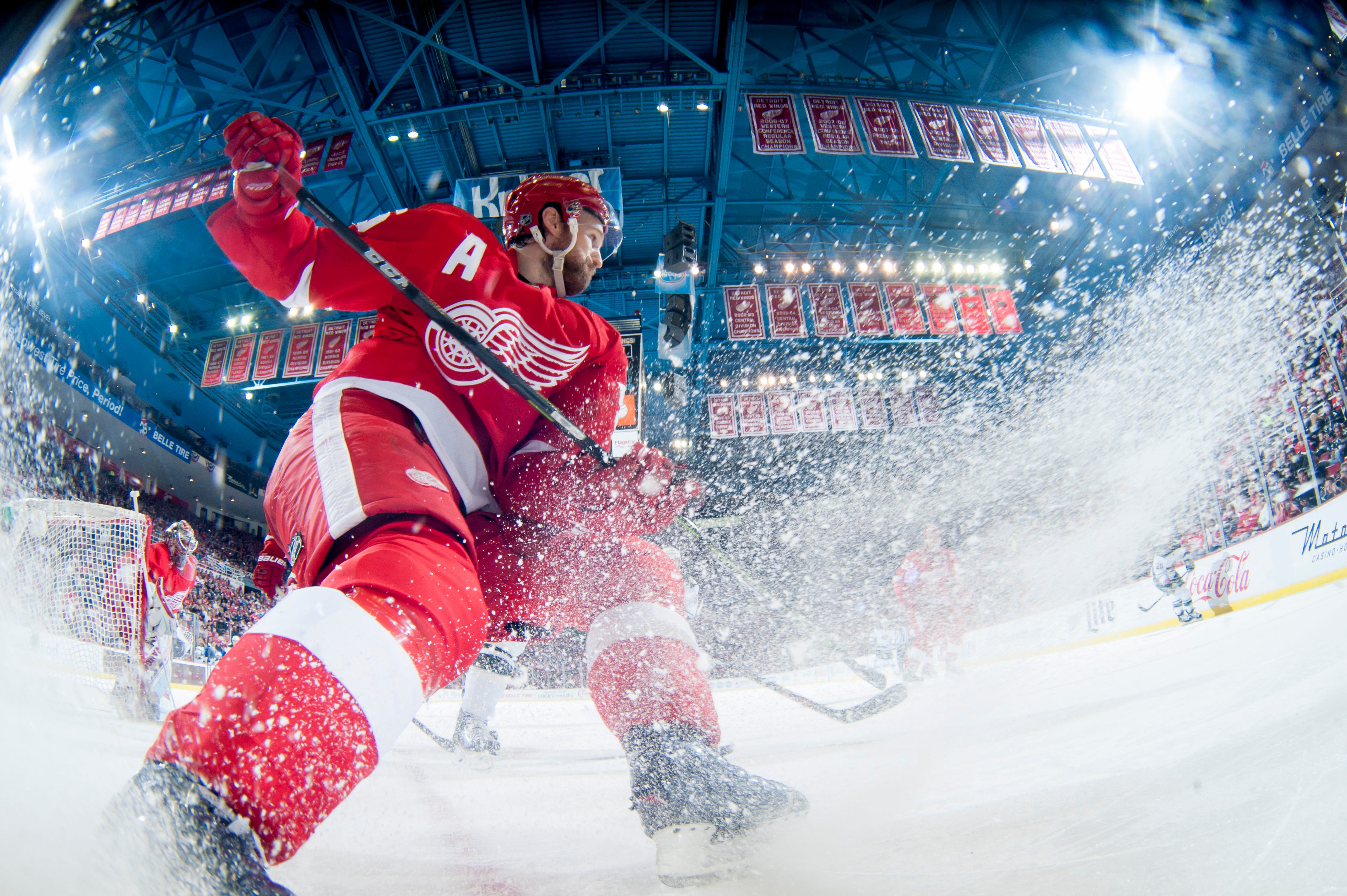 Detroit defenseman Niklas Kronwall sprays ice while making a play for the puck during a game against the Minnesota Wild at Joe Louis Arena in Detroit on Jan. 20, 2015.