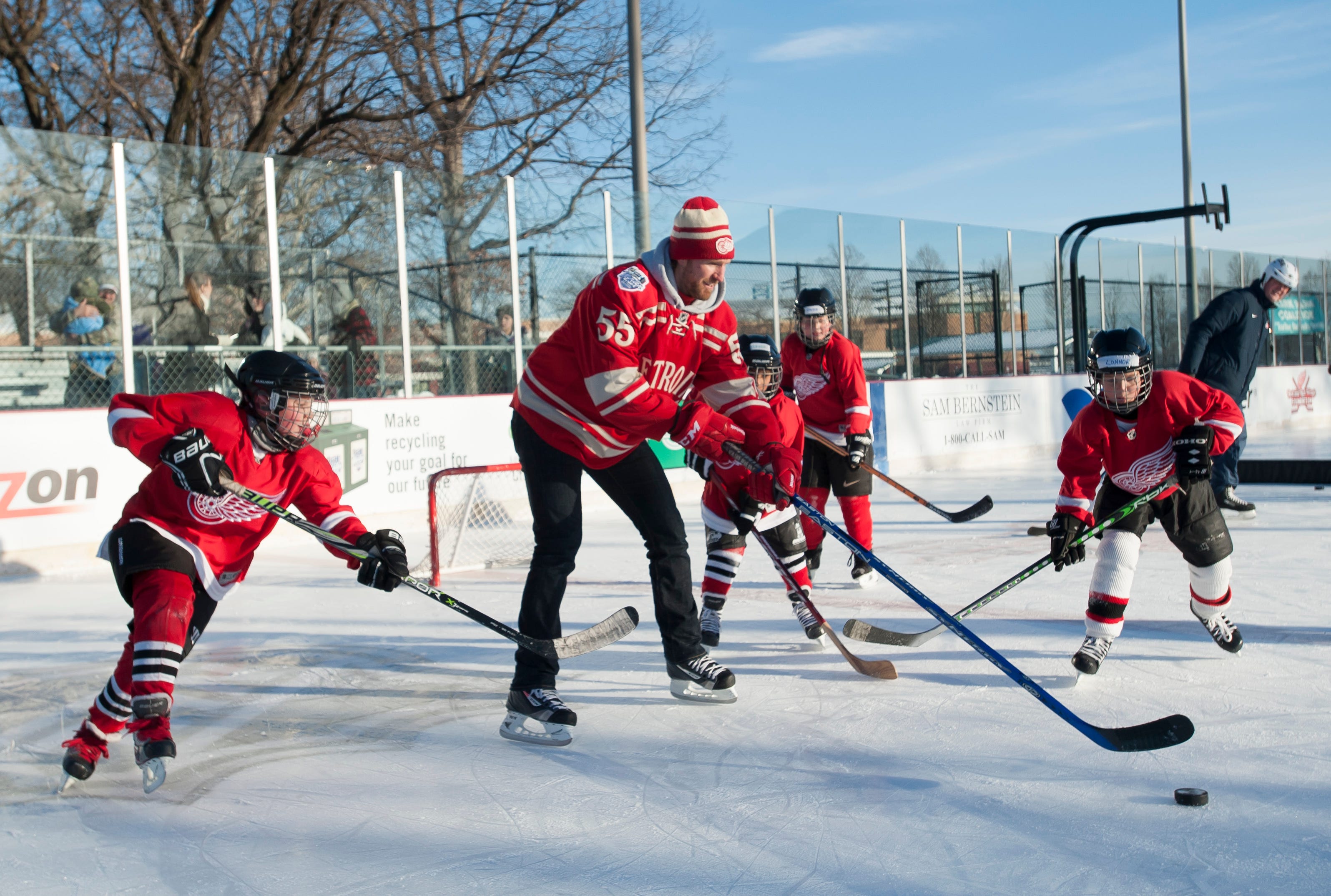 Detroit Red Wings ' Niklas Kronwall puts on a hockey clinic as part of the event. Photos are of an event at Clark Park in Detroit on Dec. 16, 2013.
