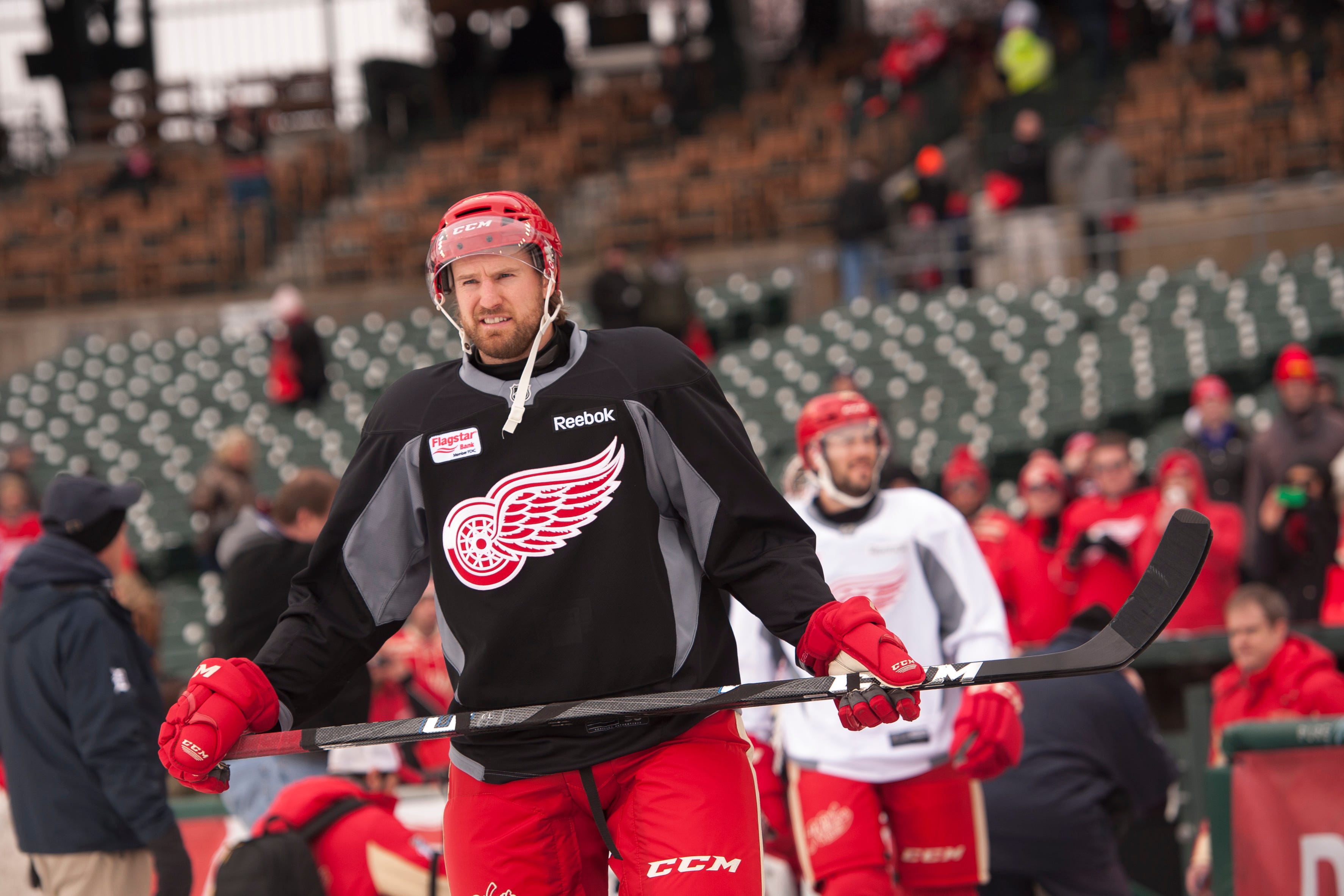 Niklas Kronwall walks out onto the field for practice at Comerica Park in Detroit on Dec. 18, 2013.