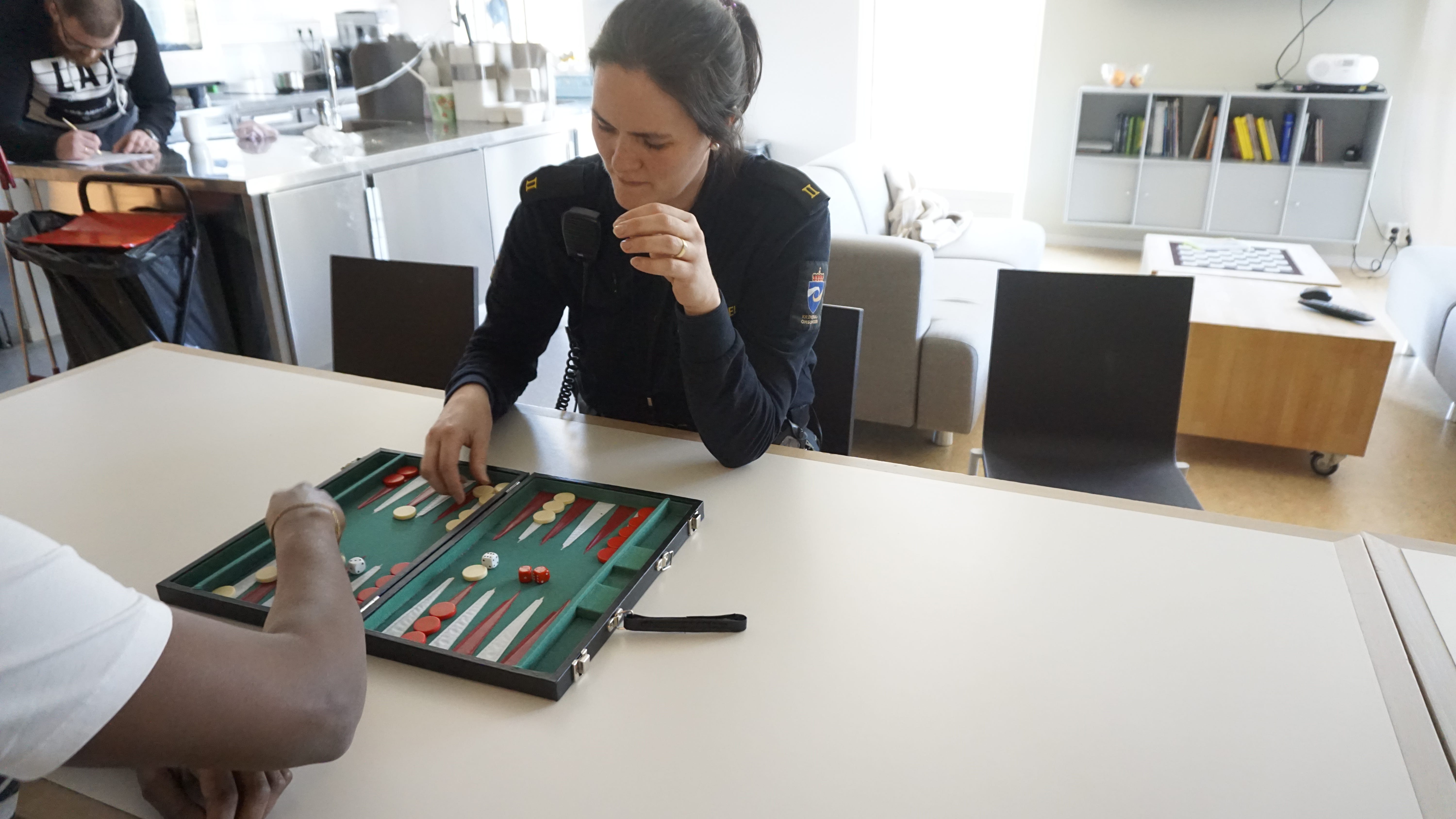 Liv Renate Saevik, a student correctional officer, plays a game with an inmate at Halden Prison. It takes two years to become a correctional officer in Norway, including a year in the classroom and a year of work with inmates.