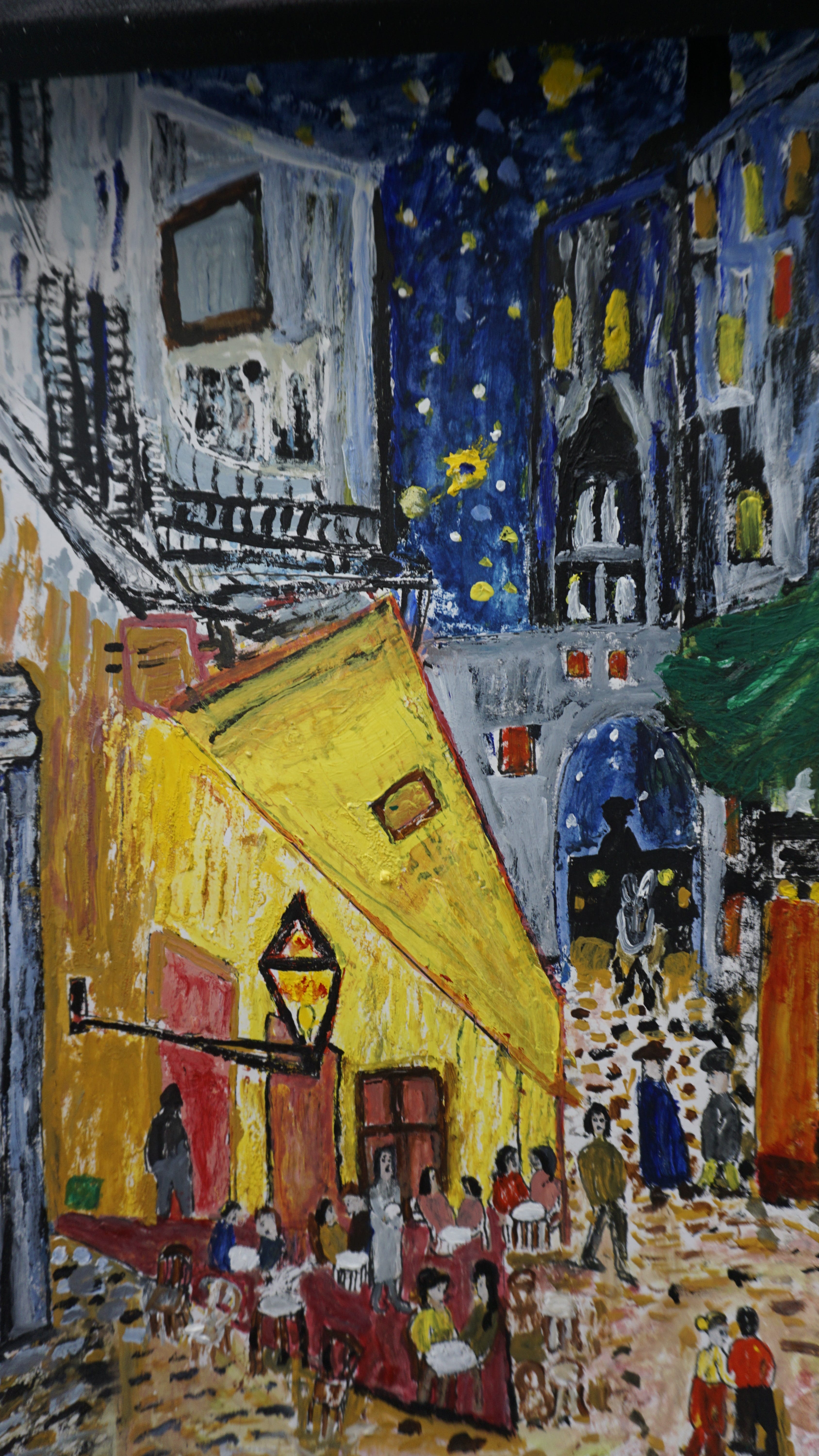 Paintings by inmates, such as this colorful depiction of a town at night, hang on walls throughout Halden Prison in Norway.