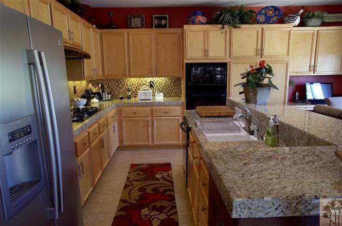 The villa includes two master bedrooms, granite counters in the kitchen, a breakfast counter, a bar and a dining area.