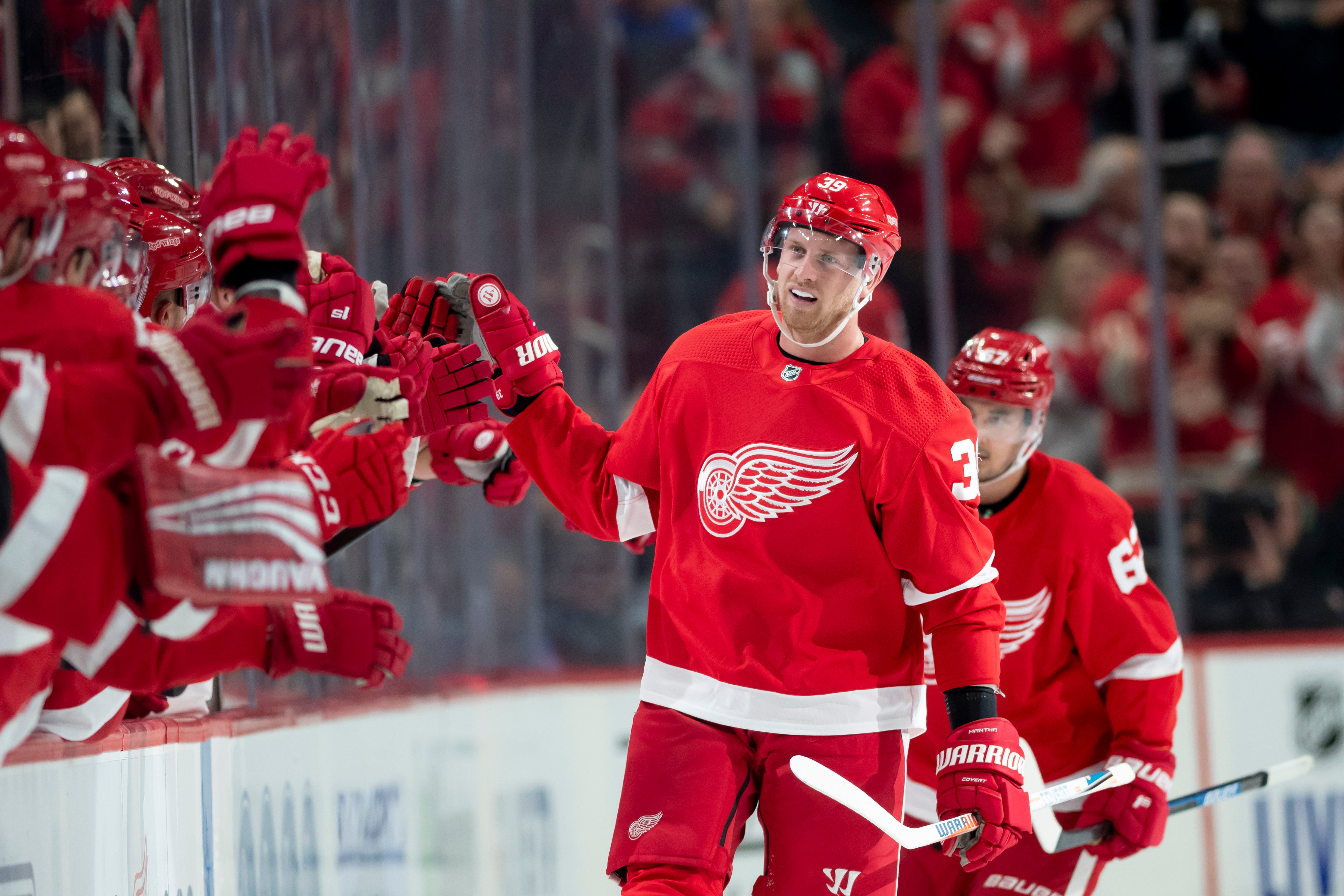 Detroit right wing Anthony Mantha high-fives his teammates after scoring in the second period.