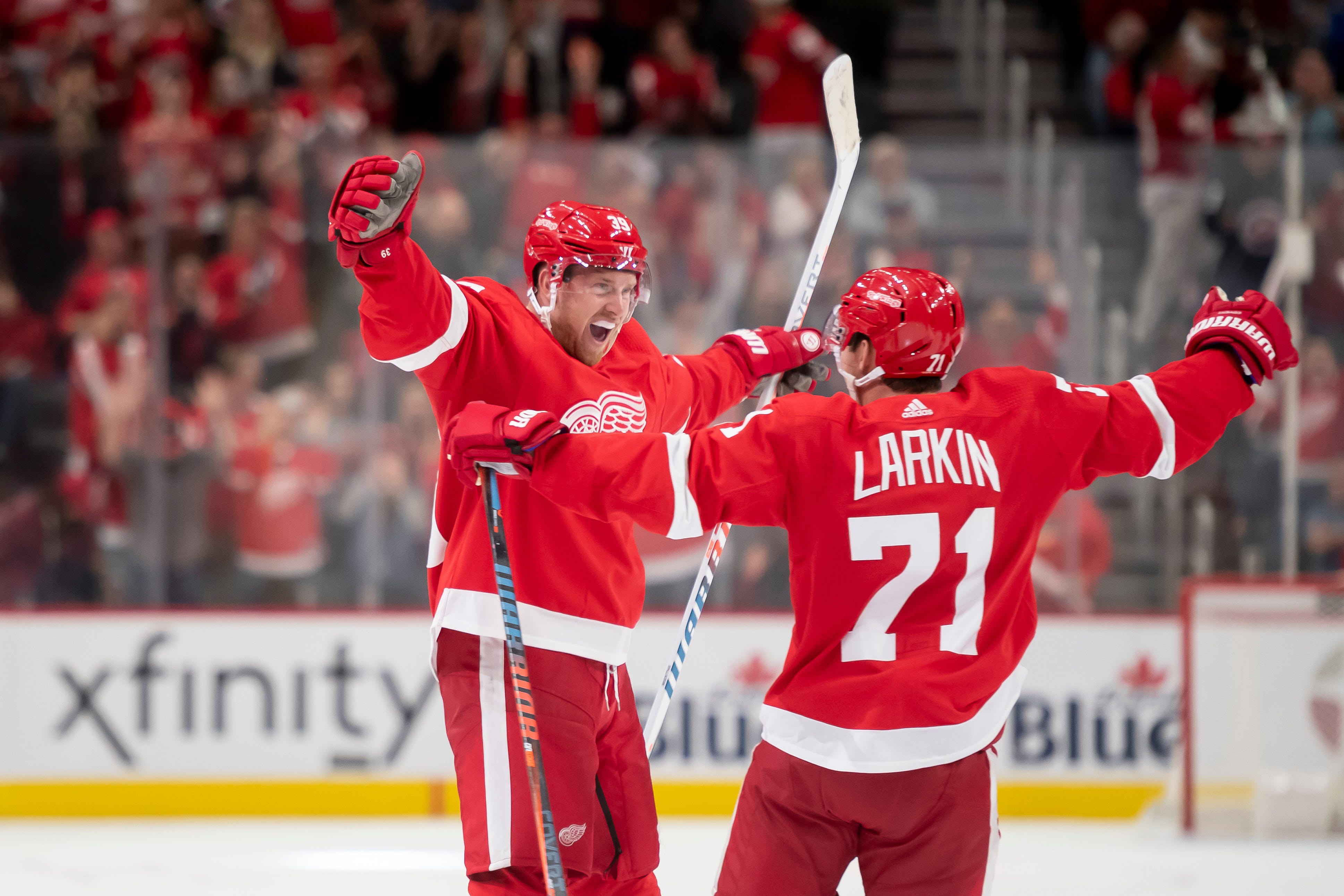 Detroit right wing Anthony Mantha, left, and center Dylan Larkin celebrate Mantha's fourth goal of the game in the third period during the Red Wings home opener at Little Caesars Arena, October 6, 2019.  Mantha scored all of Detroit's goals in the 4-3 win over Dallas