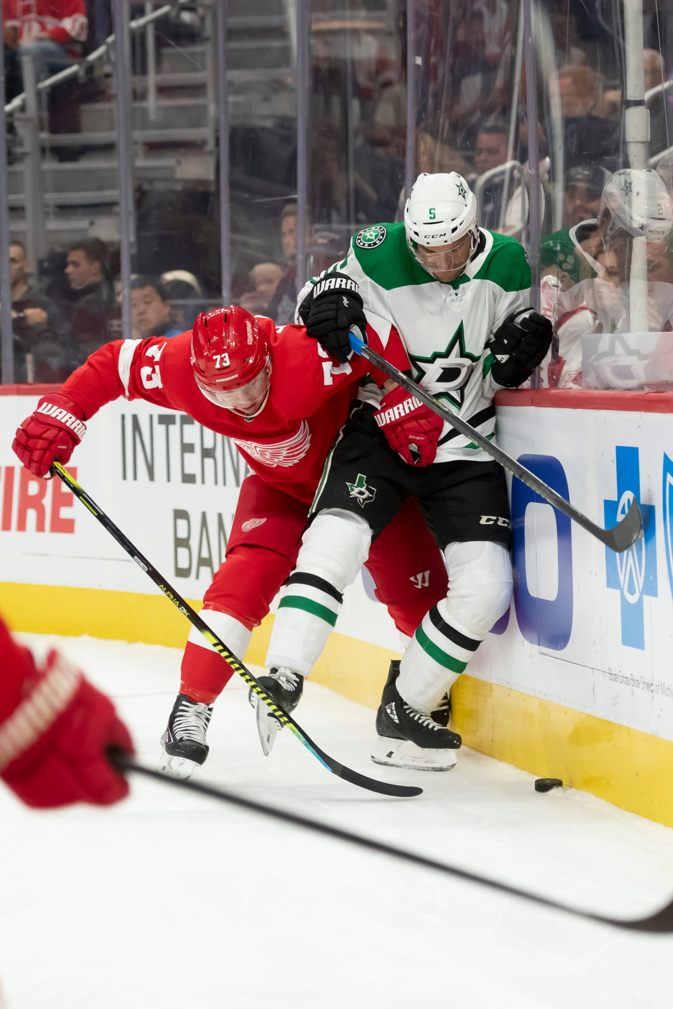 Detroit left wing Adam Erne and Dallas defenseman Andrej Sekera battle for the puck during the first period.