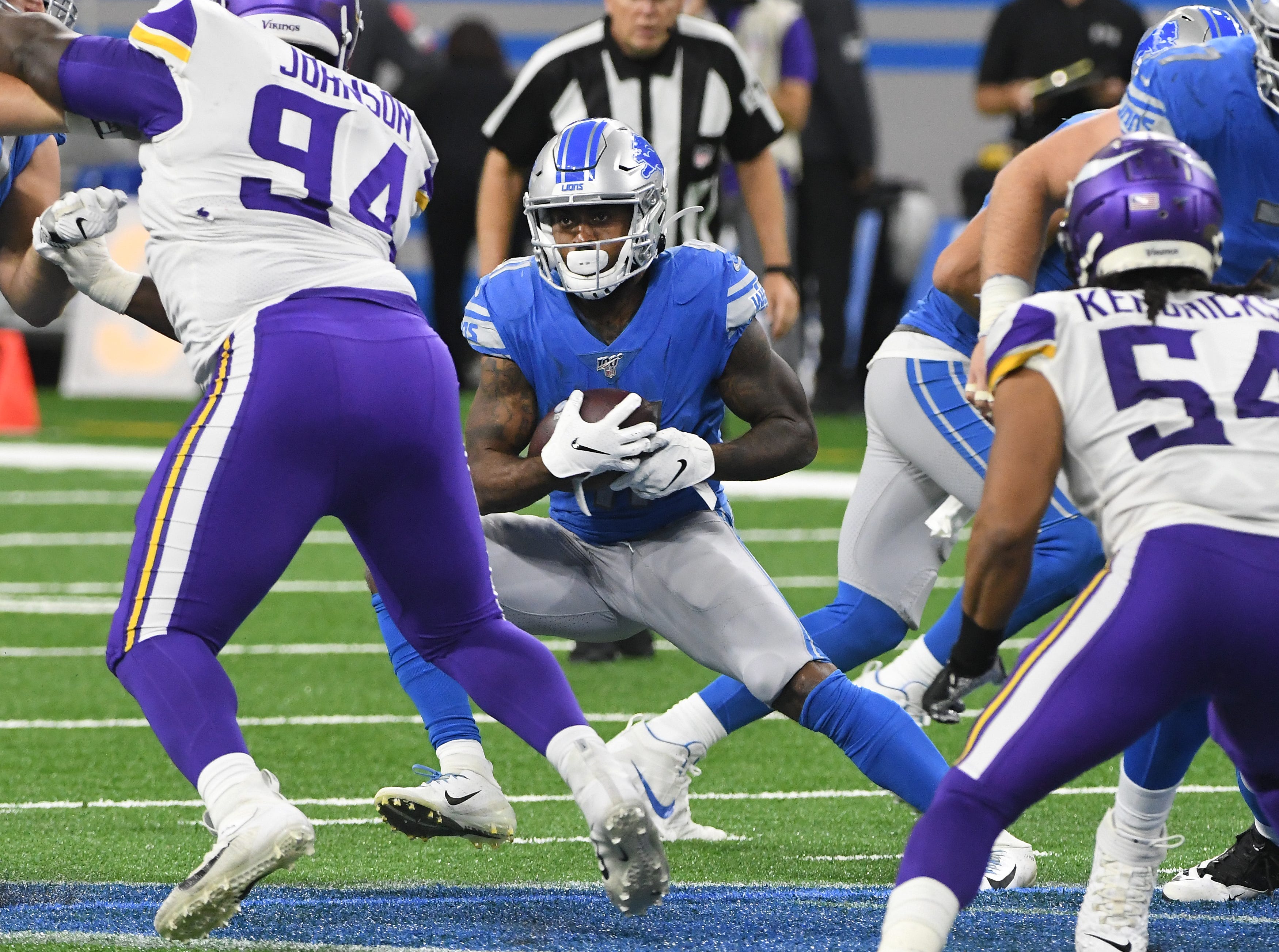 Lions running back J.D. McKissic looks for an opening in the line but finds nothing in the fourth quarter.