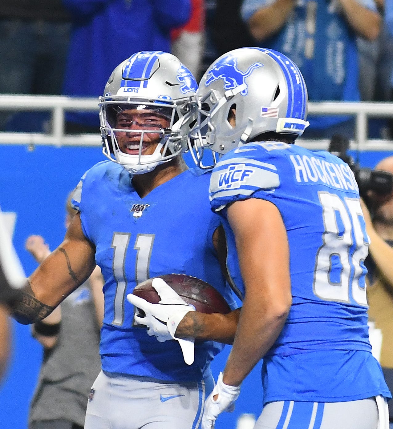 Lions ' Marvin Jones celebrates with teammate T.J. Hockenson after his third touchdown reception in the second quarter.