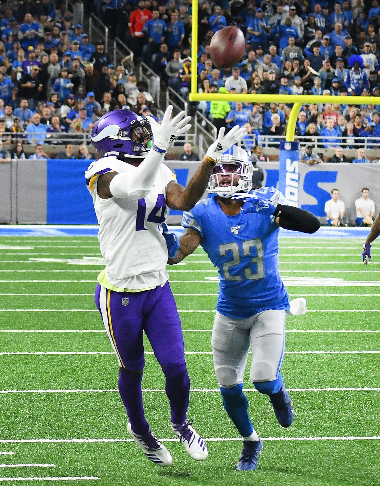 Vikings' Stefon Diggs gets ahead of Lions' Darius Slay for a completion in the second quarter.