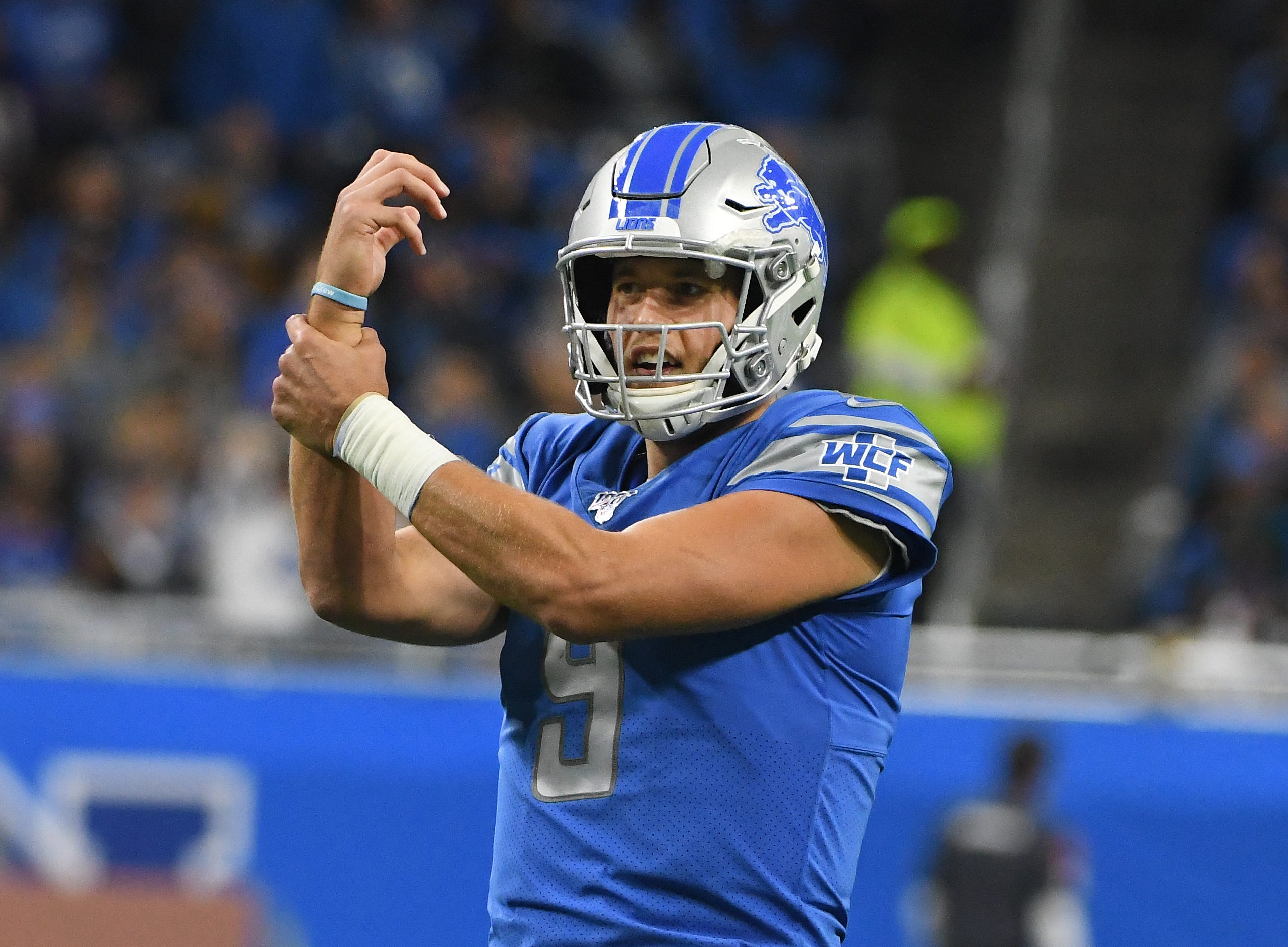 Lions quarterback Matthew Stafford gestures to officials on the field after not agreeing with a call in the second quarter.