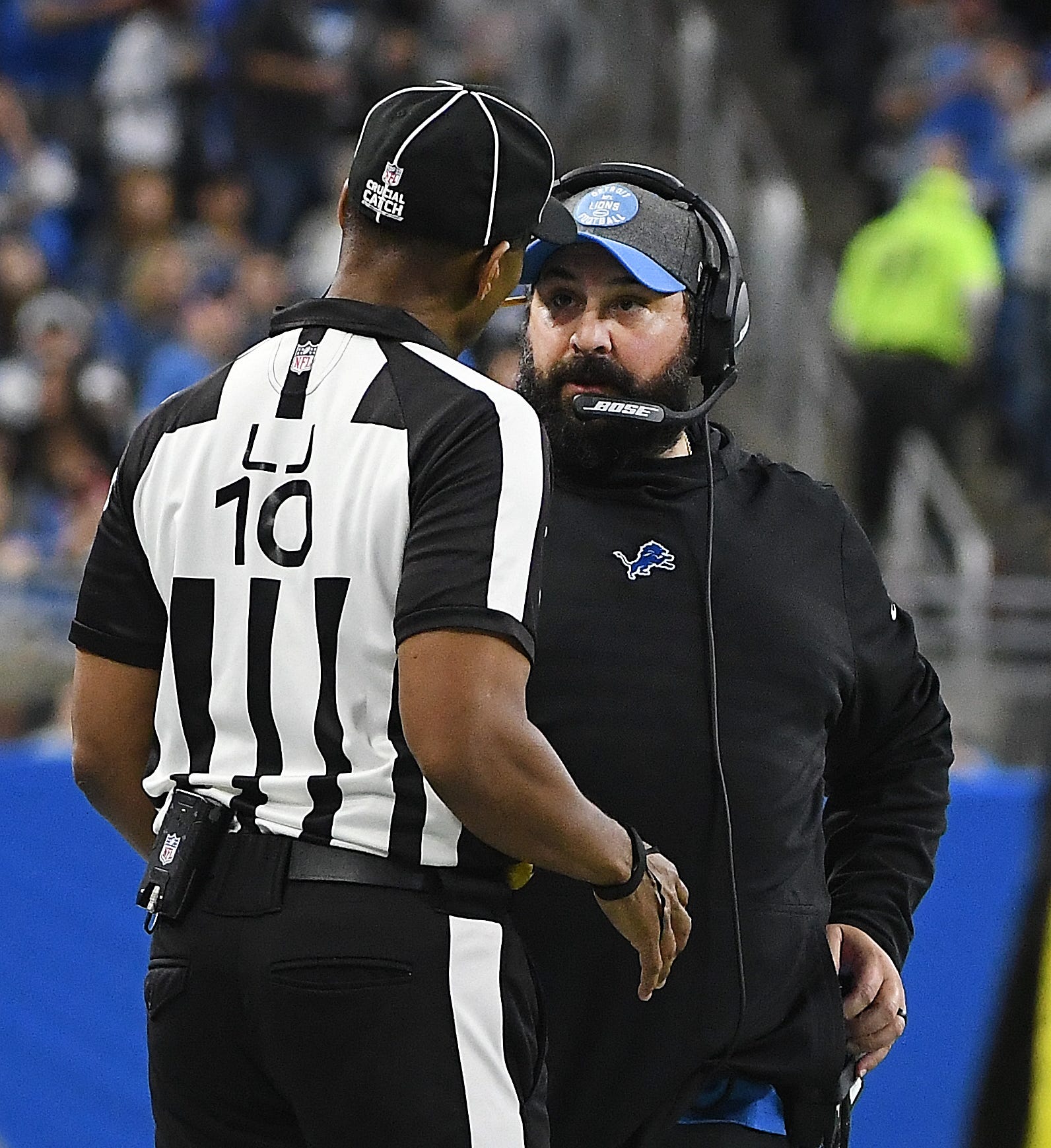 Lions head coach Matt Patricia talks with line judge Julian Mapp on the sidelines in the fourth quarter.