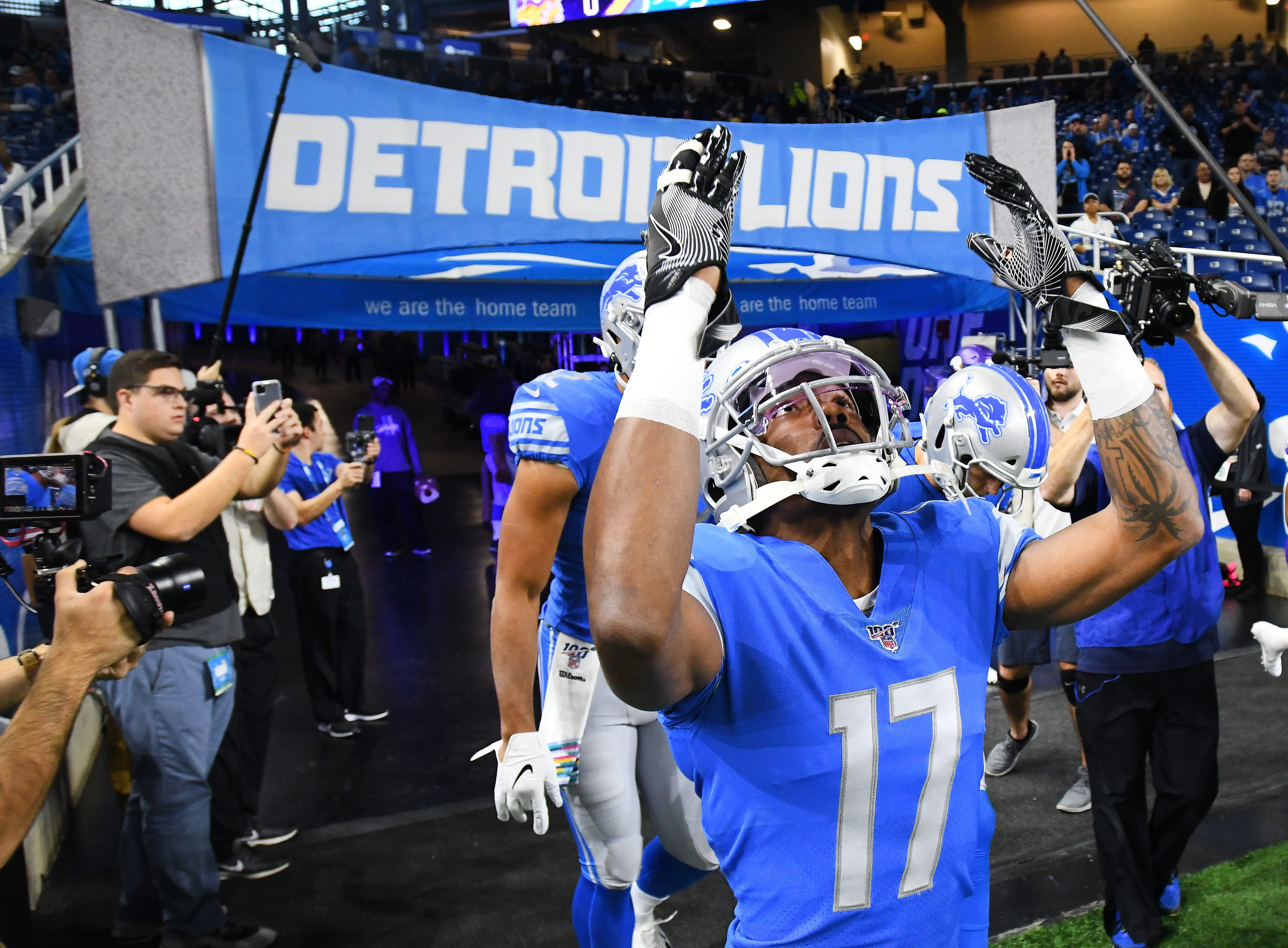 Lions wide receiver Marvin Hall looks skyward as he and Detroit head out onto the field.