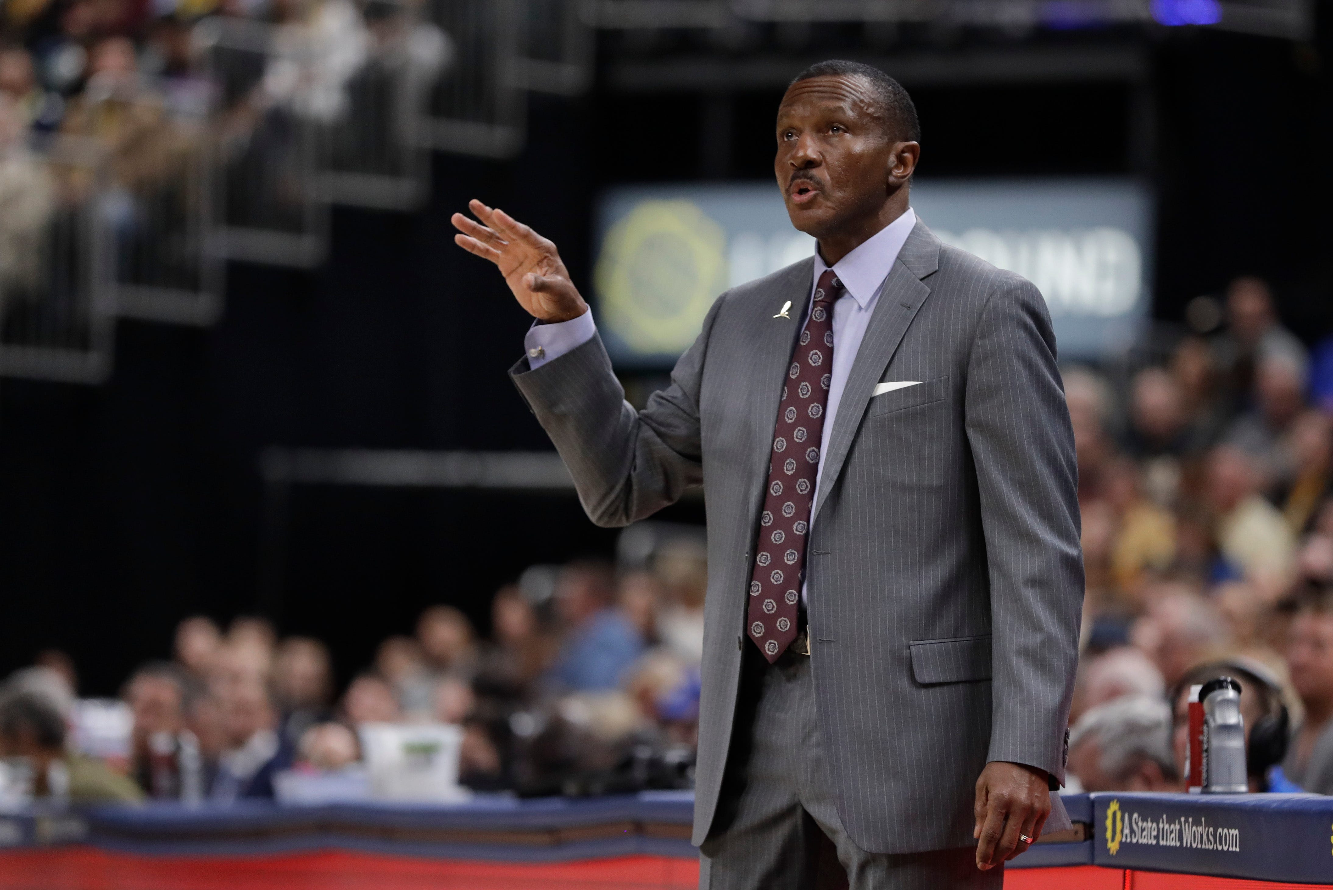 Detroit Pistons coach Dwane Casey calls a play during the first half.