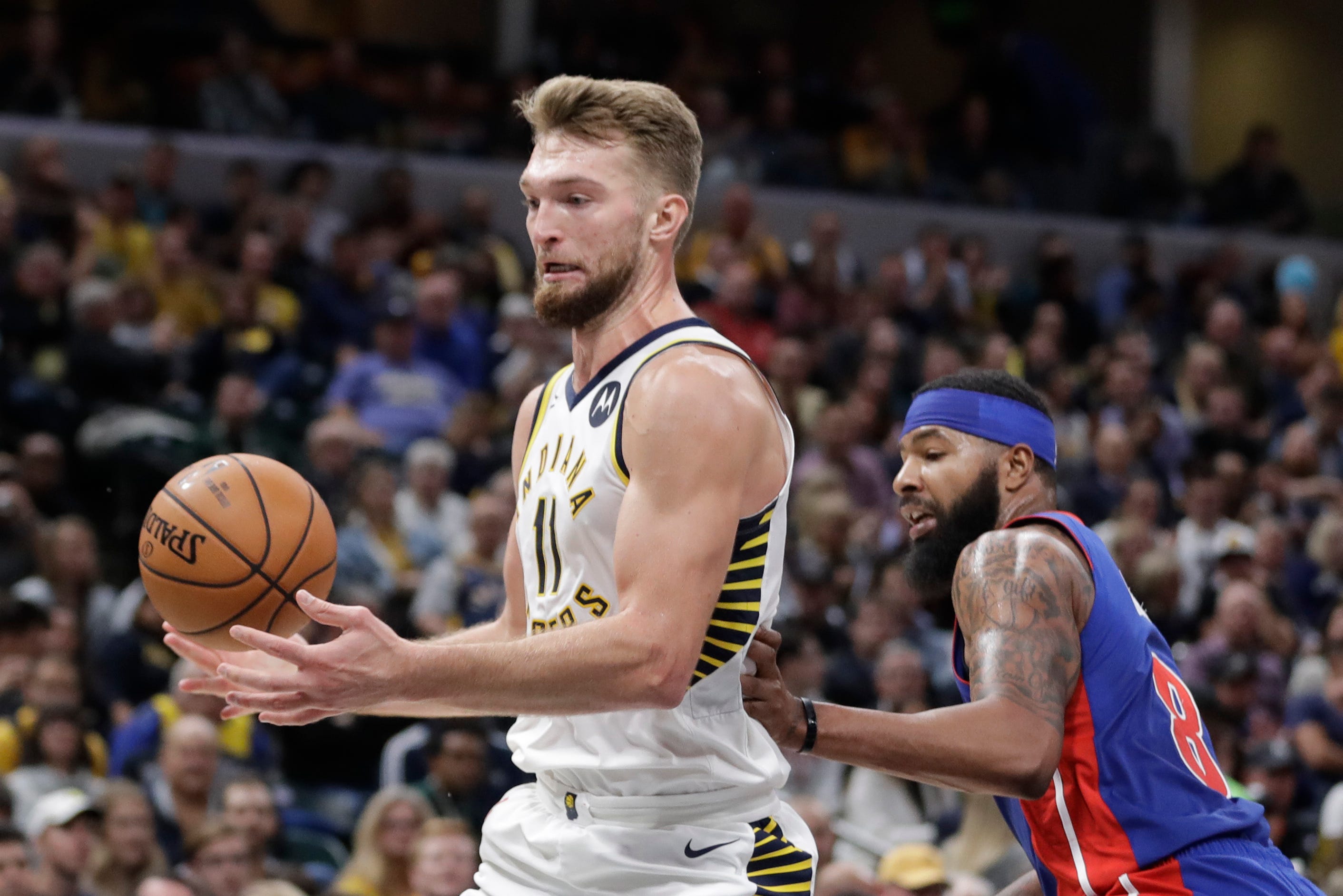 Indiana Pacers ' Domantas Sabonis, left, is defended by Detroit Pistons ' Markieff Morris during the second half.