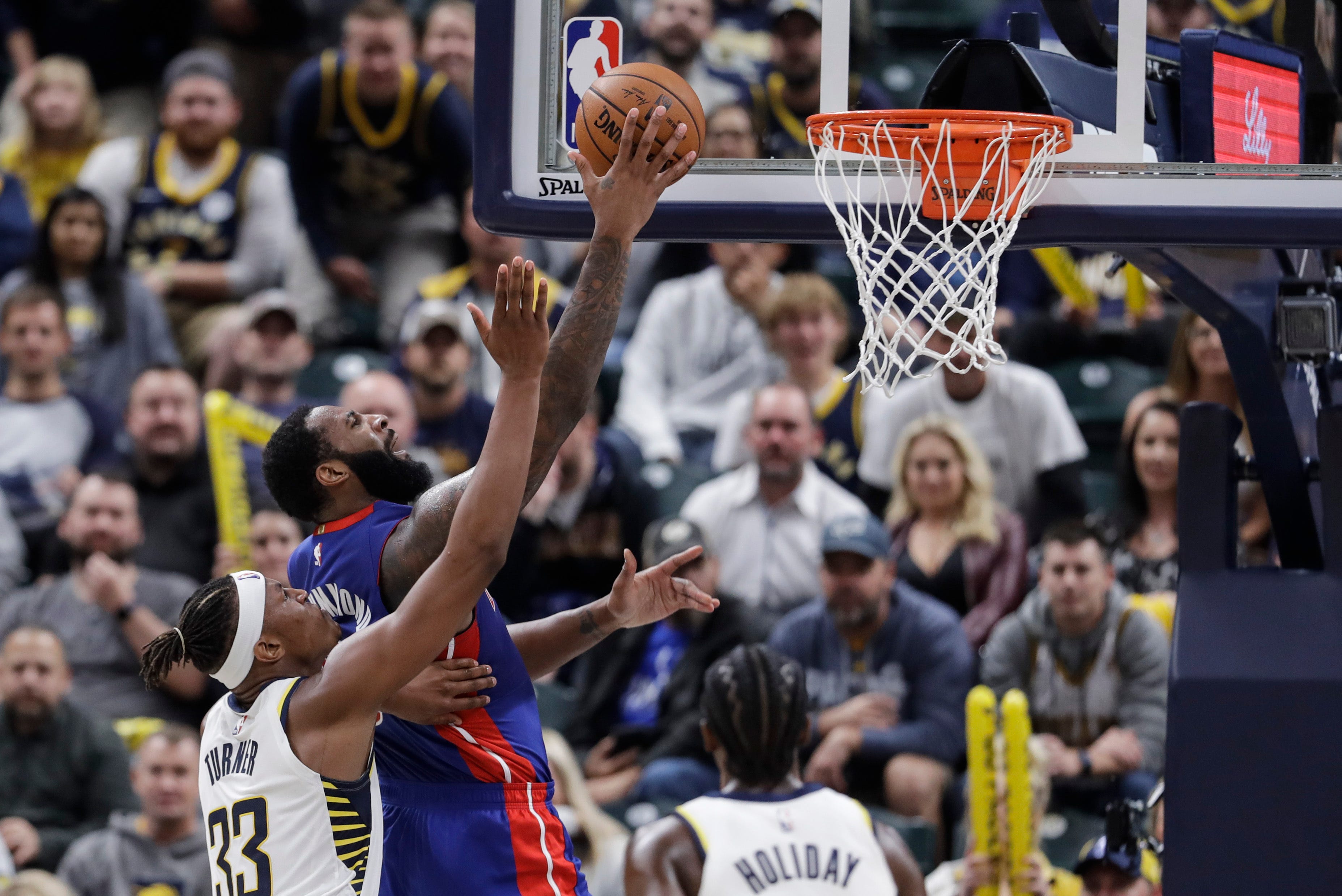 Detroit Pistons' Andre Drummond (0) goes to the basket against Indiana Pacers' Myles Turner (33) during the second half.