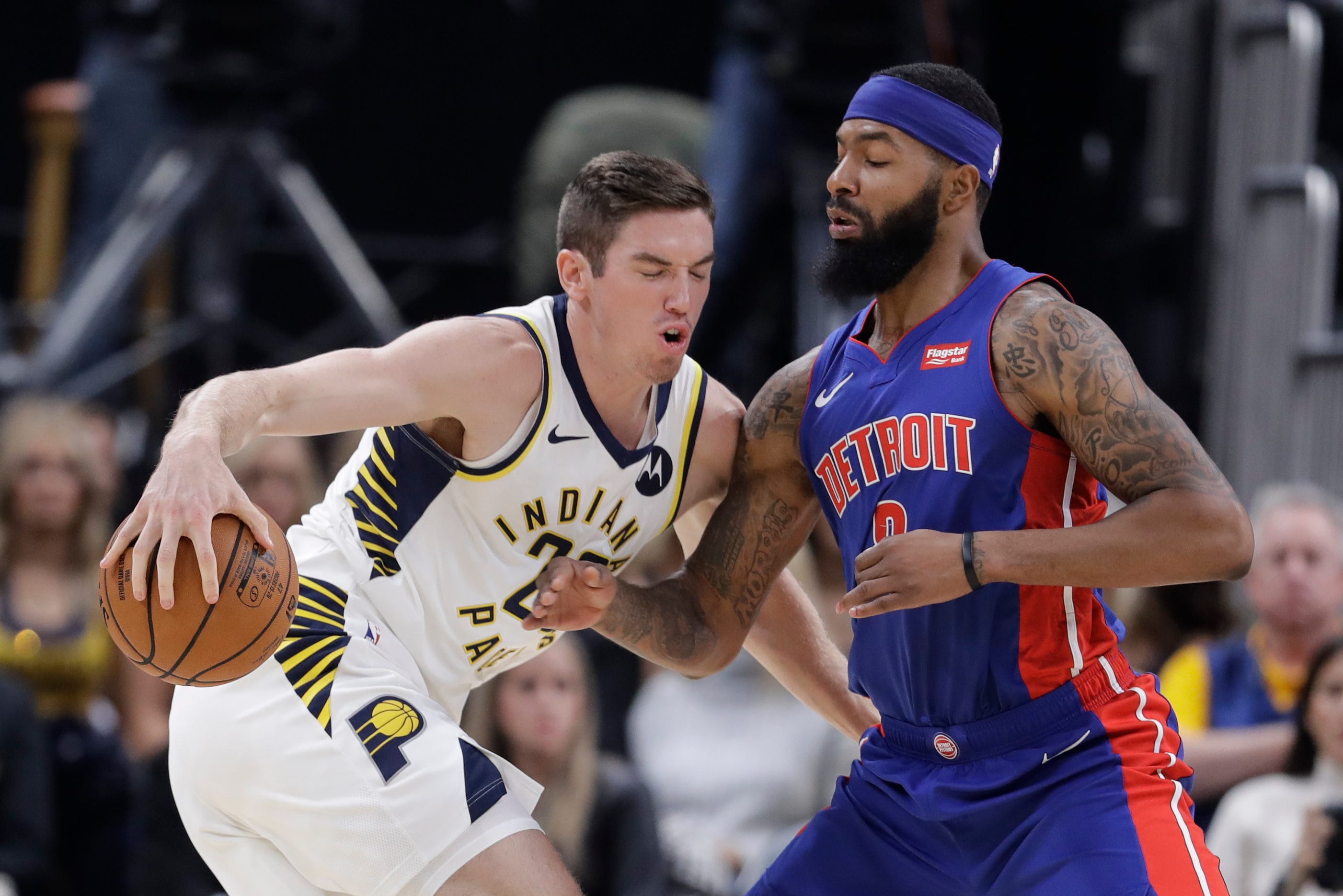 Indiana Pacers' T.J. Leaf (22) is defended by Detroit Pistons' Markieff Morris (8) during the first half.