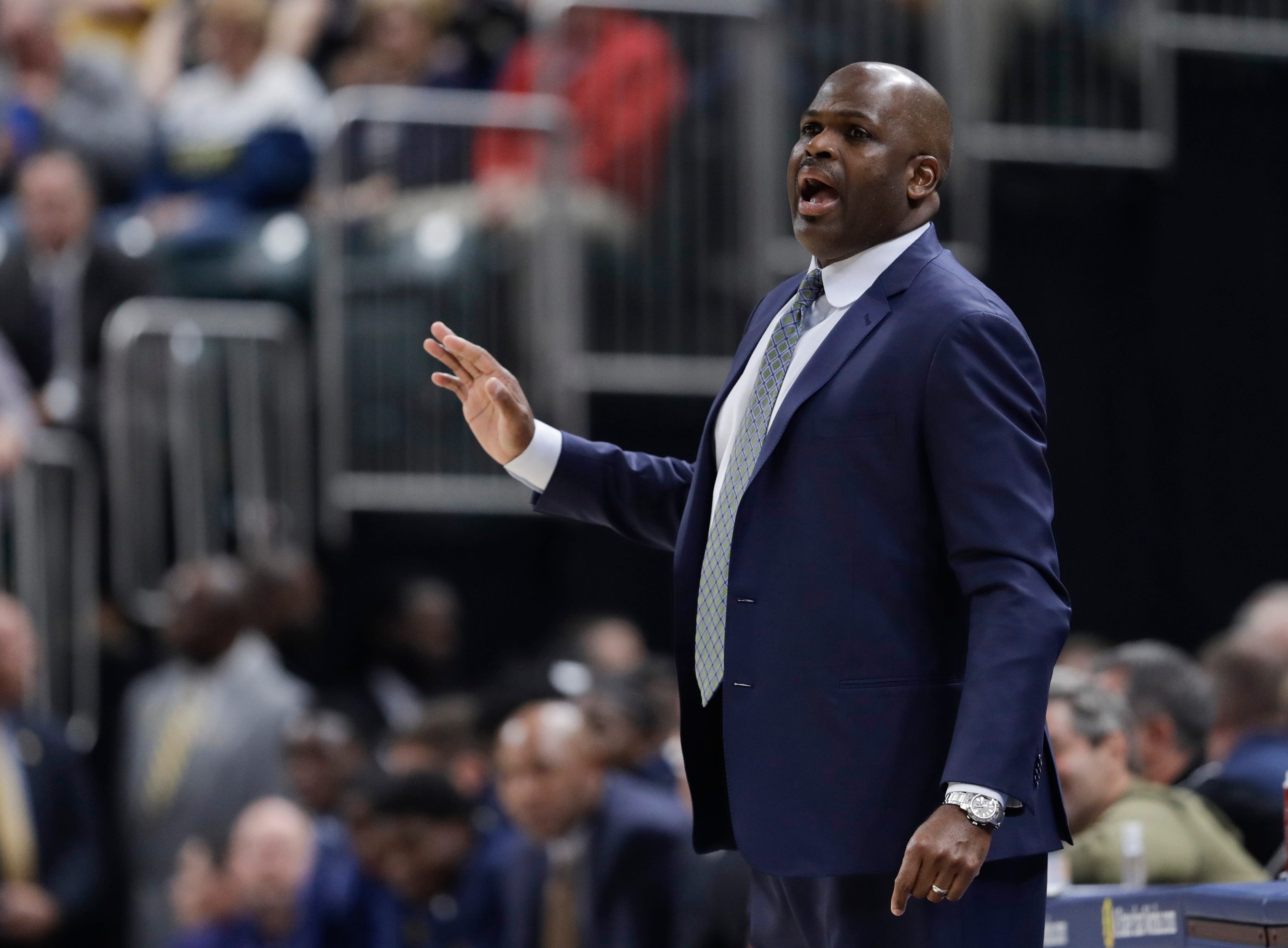 Indiana Pacers coach Nate McMillan calls a play during the first half.