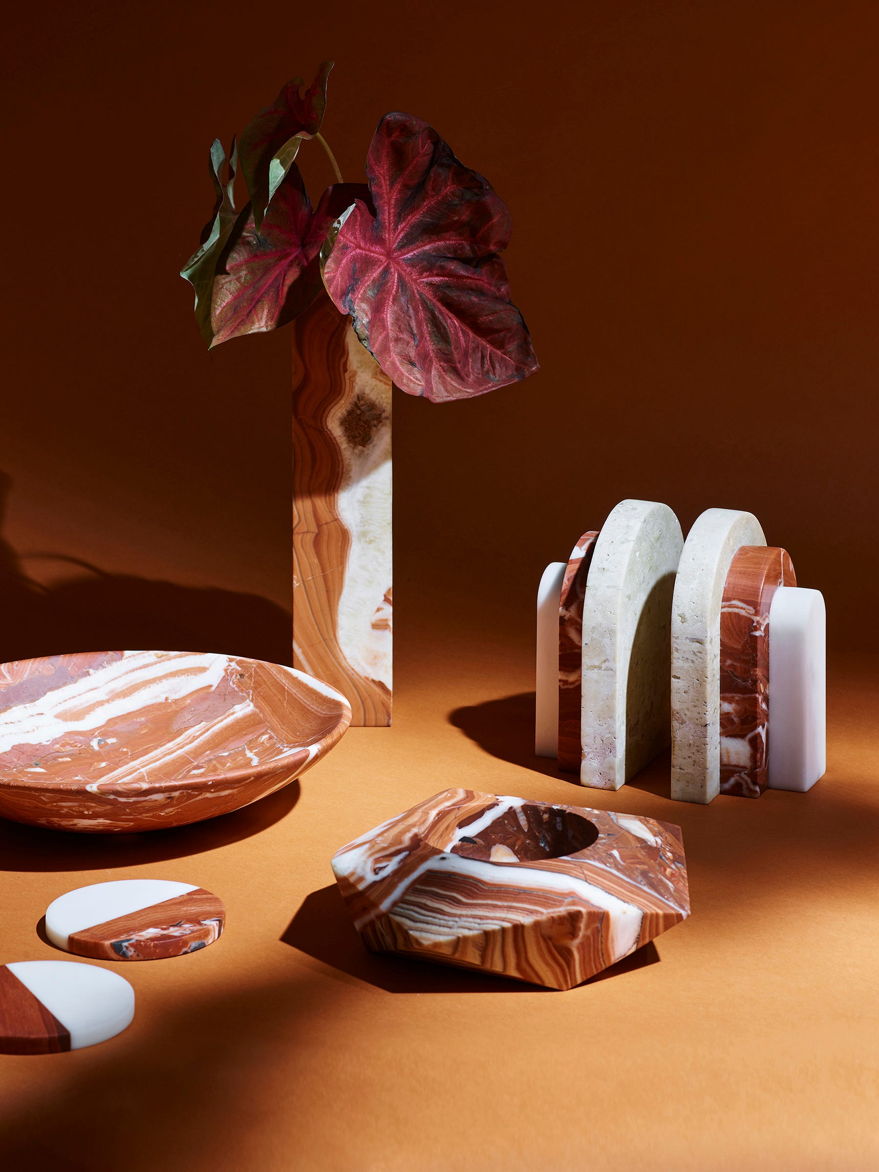 Many of the pieces in this range of Rosso marble accessories was inspired by the modernist architecture of Oscar Niemeyer. The stones were chosen for their color and graining, but as it's a natural product, patterns may vary slightly.