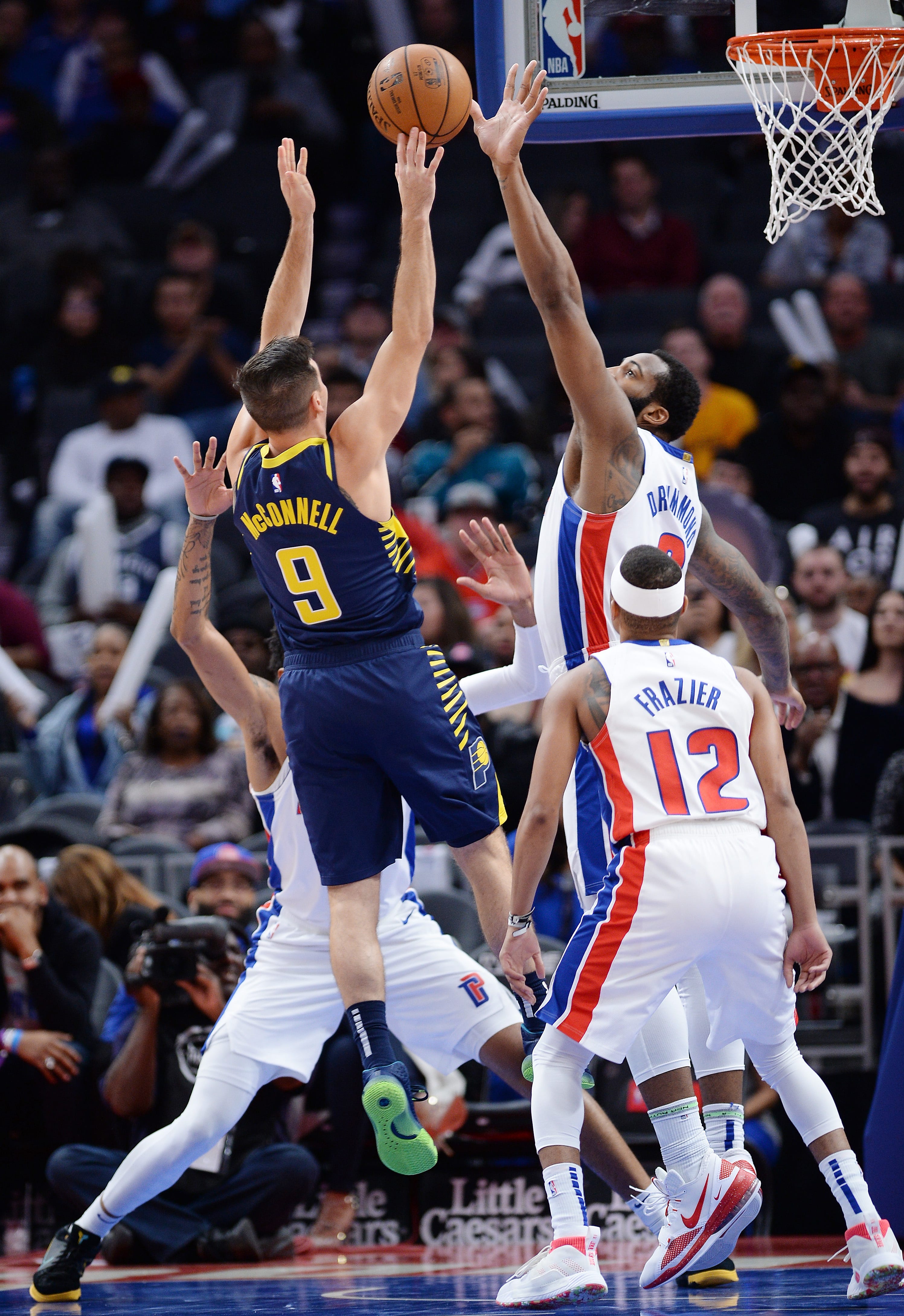 Pistons' Andre Drummond blocks the shot of Pacers' T.J. McConnell in the first quarter.